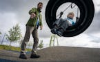 Keith Nagel plays with his son Sawyer, 3, during a Twin Cities Dads playgroup at Central Park in Maple Grove.
