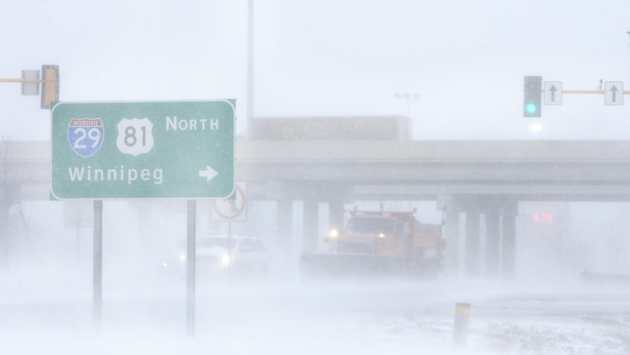 A snowplow clears snow off of Gateway Drive near I-29 in Grand Forks Monday as blizzard Gigi moves through the Red River Valley.JOHN STENNES/GRAND FORKS HERALD