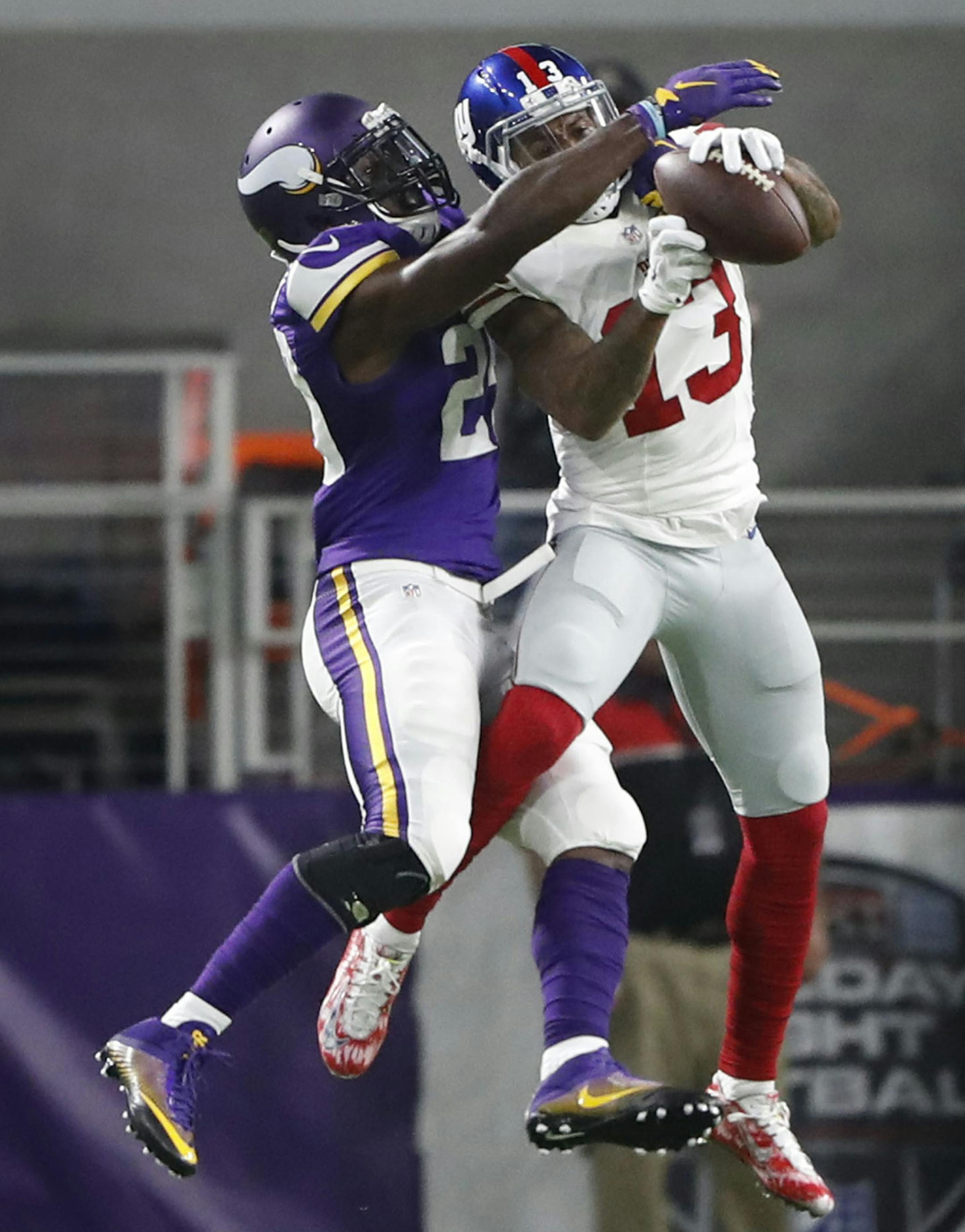 Minnesota Vikings cornerback Xavier Rhodes (29) tipped the ball away from New York Giants wide receiver Odell Beckham (13) in the second quarter. The Vikings faced the New York Giants in an NFL Monday Night Football game on October 3, 2016 at U.S. Bank Stadium in Minneapolis MN. (Jerry Holt/Minneapolis Star Tribune/TNS) ORG XMIT: 1191102