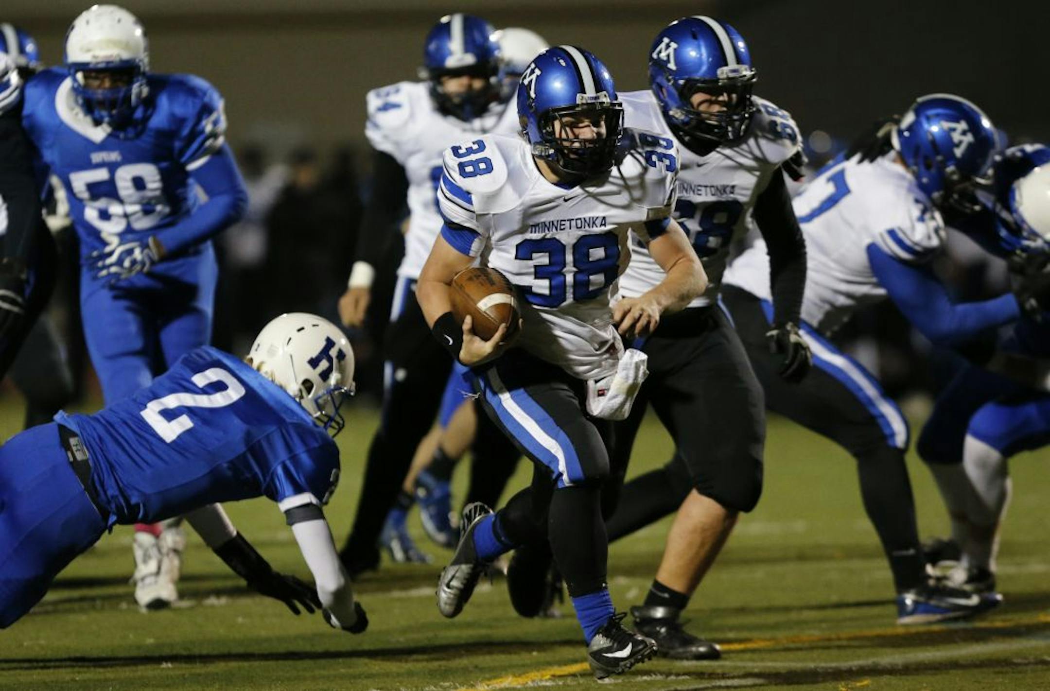 Minnetonka's Ian Cote broke through the Hopkins defense for a gain in Friday's Class 6A playoff game. The Skippers won 35-14. They play at Maple Grove on Friday. Photo by Kyndell Harkness • kharkness@startribune.com