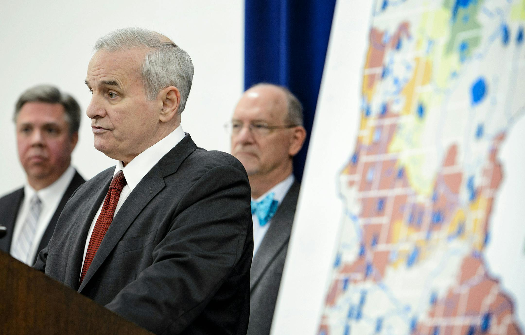 Governor Mark Dayton announced a $220 million plan to protect water quality andf modernize Minnesota's aging water infrastructure. The map shows how many streams and rivers are compromised and unsafe for swimming and recreation. Behind him are Minnesota Public Facilities Director Jeff Freeman and health Commissioner Edward Ehlinger. ] GLEN STUBBE * gstubbe@startribune.com Thursday, January 14, 2015 Governor Mark Dayton announced a $220 million plan to protect water quality andf modernize Minneso