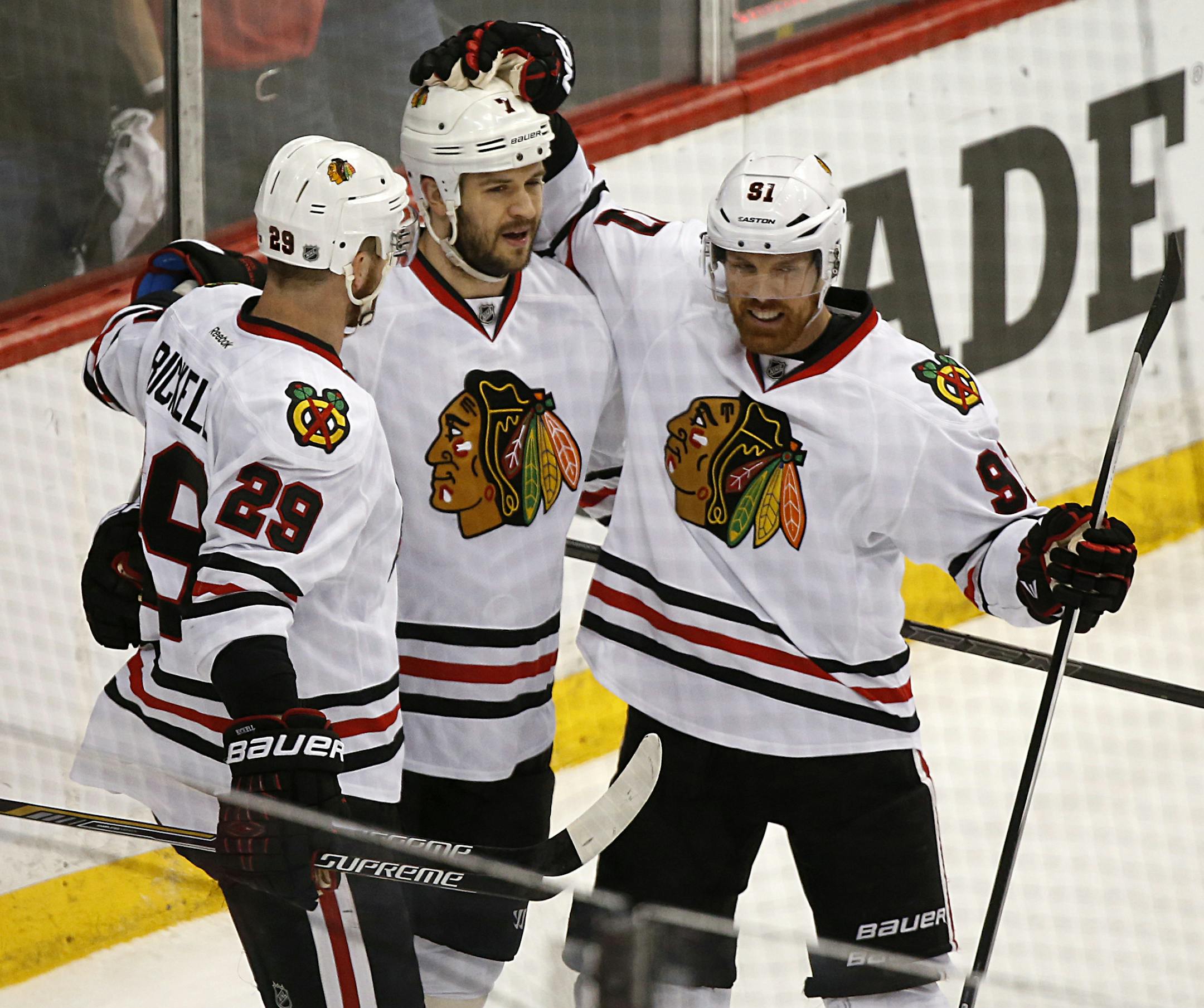 Chicago Blackhawks left wing Bryan Bickell (29) and center Brad Richards (91) celebrated with defenseman Brent Seabrook (7) after Seabrook's goal against Minnesota in the first period. ] CARLOS GONZALEZ cgonzalez@startribune.com, May 7, 2015, St. Paul, MN, Xcel Energy Center, NHL, Minnesota Wild vs. Chicago Blackhawks, Game 4, Stanley Cup Playoffs, Round 2