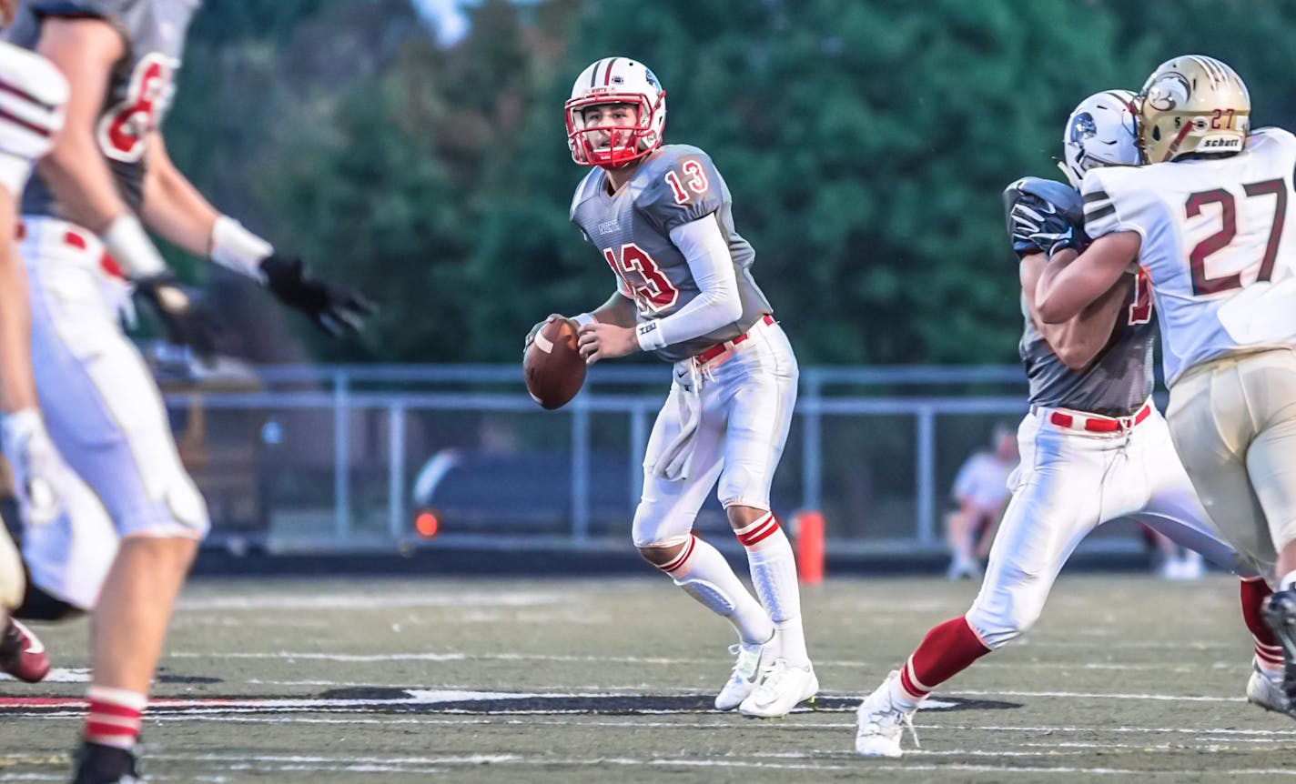 Lakeville North quarterback Brennan Kuebler drops back to pass against Lakeville South, 9-22-17. Photo by Korey McDermott, SportsEngine