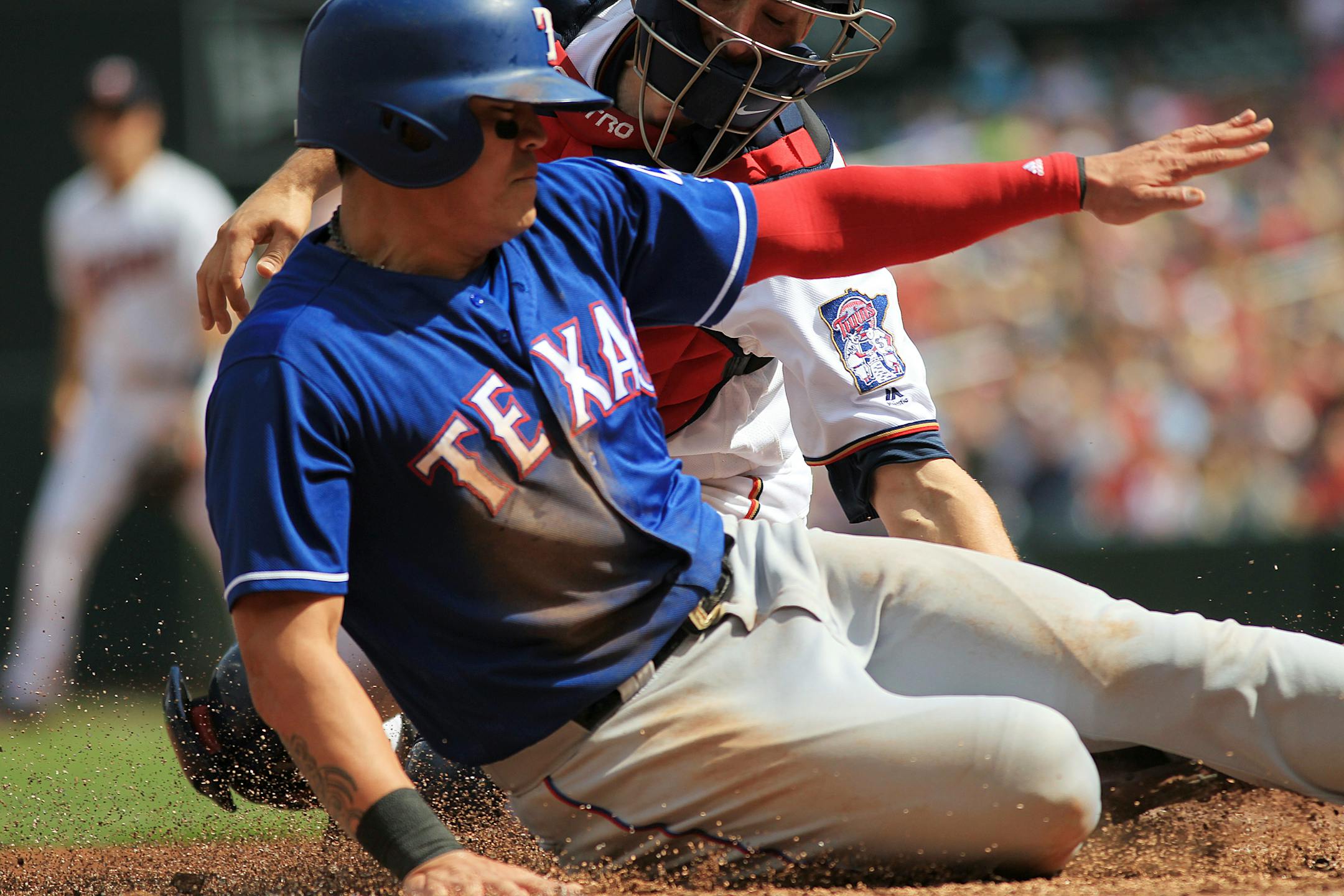 The Rangers' Shin-soo Choo was tagged out at home by Twins catcher Jason Castro in the fifth inning Sunday. The Twins decided to draw the infield in, enabling shortstop Jorge Polanco to grab Andre Beltre's hard grounder and gun down Choo at the plate.