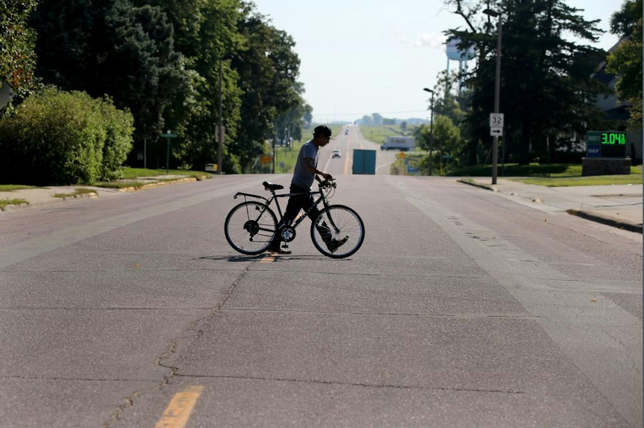 The town of Winthrop MN put its stoplight in a museum after it came down in 2015, local historians understanding it's probably the only stoplight the town will ever see. Here, a bicyclist walks his bike across Highway 19 Blvd. Thursday, Aug. 30, 2018, in Winthrop, MN.