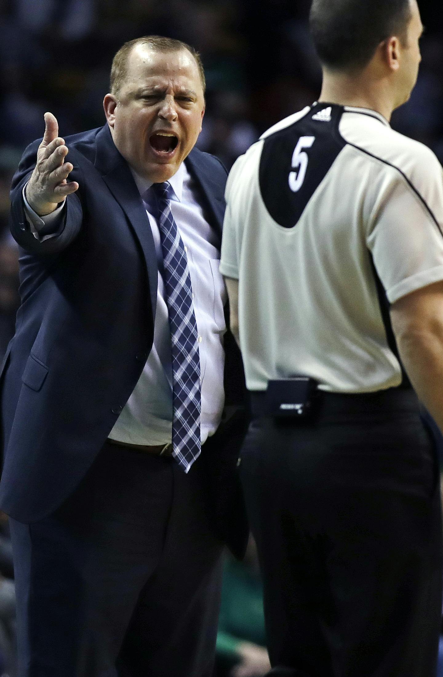 Minnesota Timberwolves head coach Tom Thibodeau argues a call with referee Kane Fitzgerald (5) during the first quarter of an NBA basketball game against the Boston Celtics in Boston, Wednesday, March 15, 2017. (AP Photo/Charles Krupa)