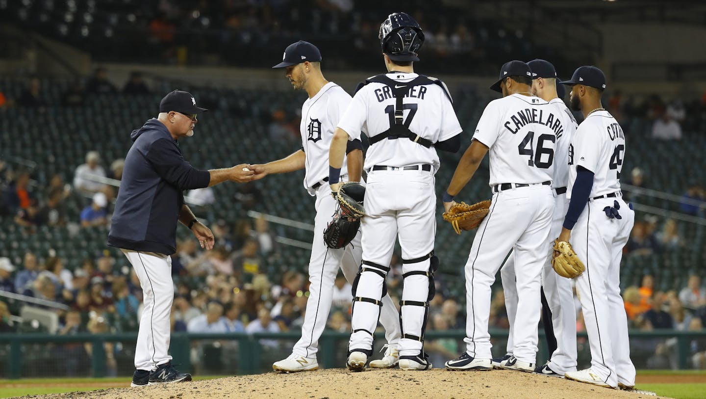 Detroit Tigers manager Ron Gardenhire takes the ball from pitcher Drew VerHagen in the eighth inning of a baseball game in Detroit, Wednesday, Sept. 25, 2019. (AP Photo/Paul Sancya)