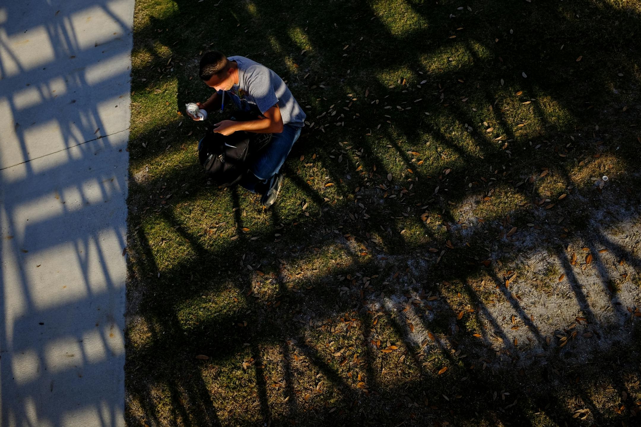 Autograph collector and seller Jeff Thompson, of Upstate New York, organized his belongings on the field near the Twins' batting cages.