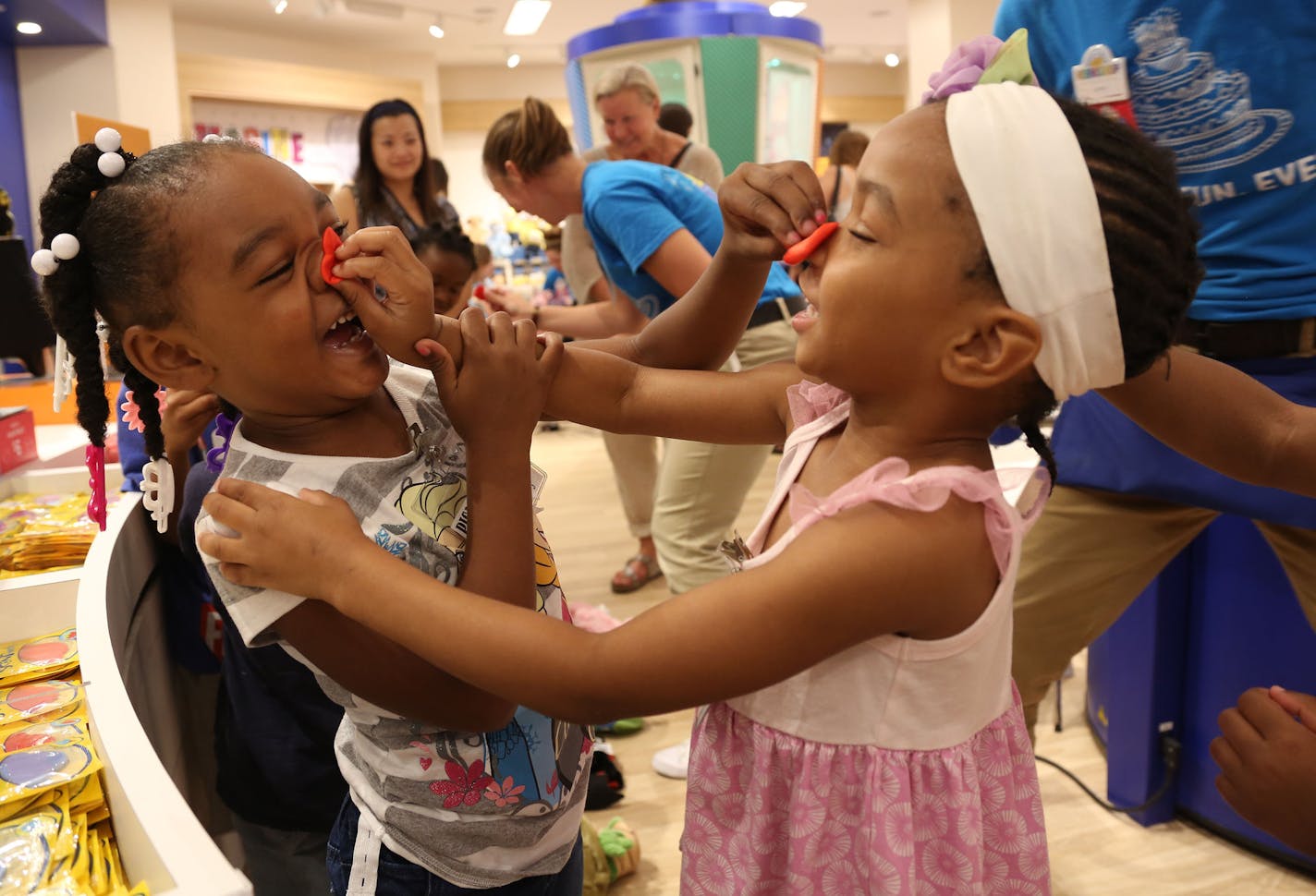 C&#xed;yanna Harris, 4, and Shamajah Rogers, 4, rubbed their hearts on each other's noses as their group from PICA Head Start in Minneapolis got stuff animals at the newly redesigned Build-a-Bear at the Mall of America before its grand reopening. This group of kids were one of the first that day to have a bear made. ] (KYNDELL HARKNESS/STAR TRIBUNE) kyndell.harkness@startribune.com At the newly redesigned Build-a-Bear in Bloomington , Min., Tuesday September, 2015.