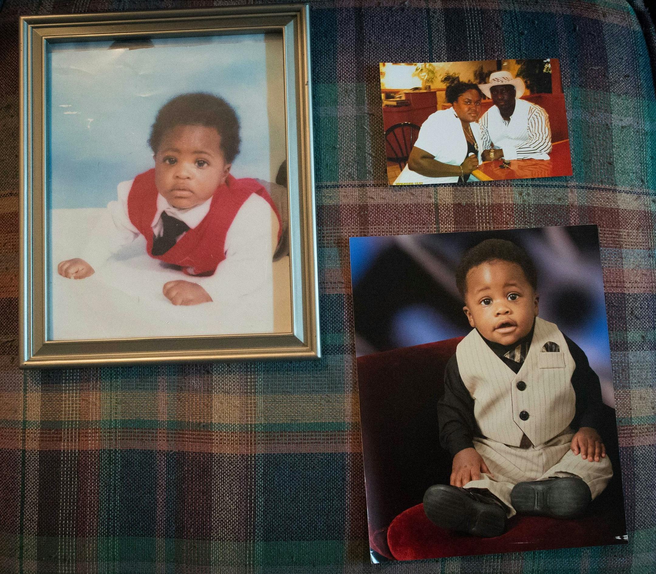 Jacob Mayson, left, now 8, Benzel Mayson, 2, and a photo of their mother and father Jacob and Bernice Mayson. The younger Jacob, Benzel and Bernice are all currently stuck in Liberia after the Nigerian airline they book suspended air travel as a result of the Ebola outbreak. ] AARON LAVINSKY • aaron.lavinsky@startribune.com Jacob Mayson has been working to get his fiancé and two children home safely from Liberia after they were stranded as a result of the Ebola outbreak in July. Maso
