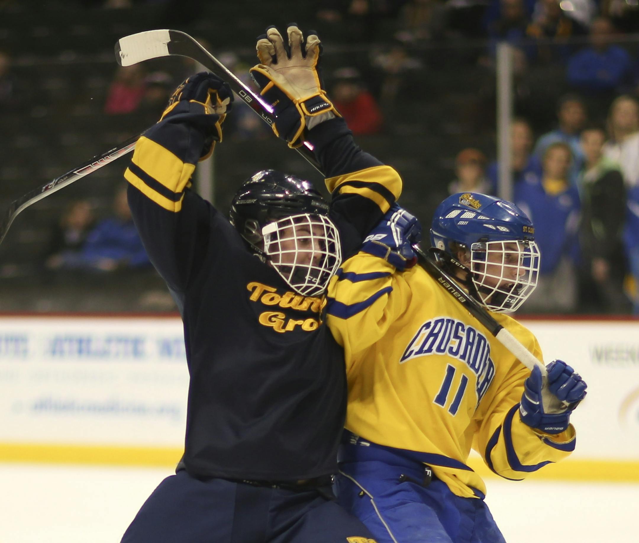 Totino-Grace defenseman Carter Lyons and St. Cloud Cathedral forward Colin Strong tangled as they headed towards the Cathedral net in the first period. ] JEFF WHEELER ‚Ä¢ jeff.wheeler@startribune.com Totino-Grace faced St. Cloud Cathedral in a quarterfinal round game in the Class A boys' state high school hockey tournament Wednesday night, March 5, 2014 at Xcel Energy Center in St. Paul.