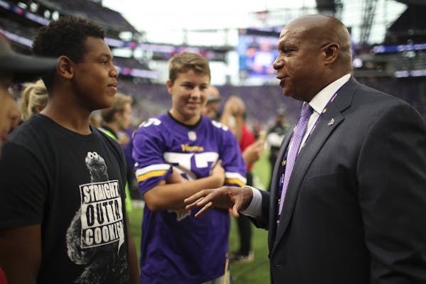 Kevin Warren with fans at a Vikings game in 2017.