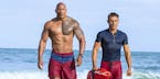 This image released by Paramount Pictures shows Dwayne Johnson, Left, and Zac Efron in a scene from, "Baywatch," in theaters May 25. (Frank Masi/Param