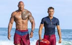 This image released by Paramount Pictures shows Dwayne Johnson, Left, and Zac Efron in a scene from, "Baywatch," in theaters May 25. (Frank Masi/Param