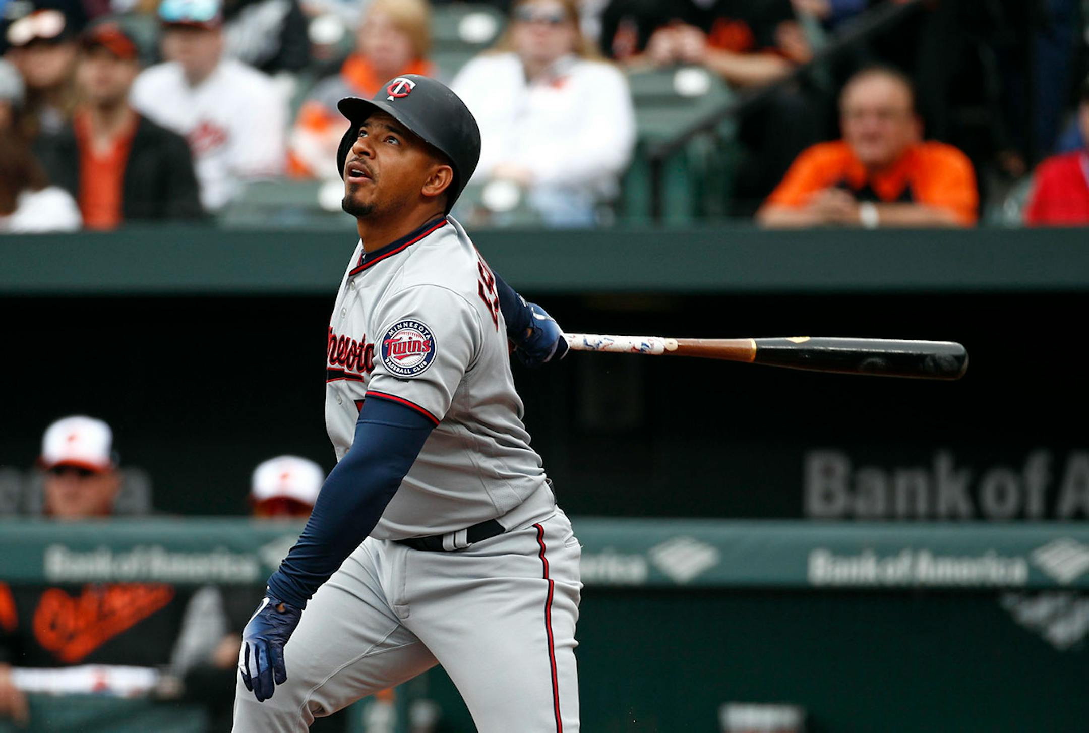 Minnesota Twins' Eduardo Escobar doubles in the first inning of a baseball game against the Baltimore Orioles, Sunday, April 1, 2018, in Baltimore. Joe Mauer scored on the play. (
