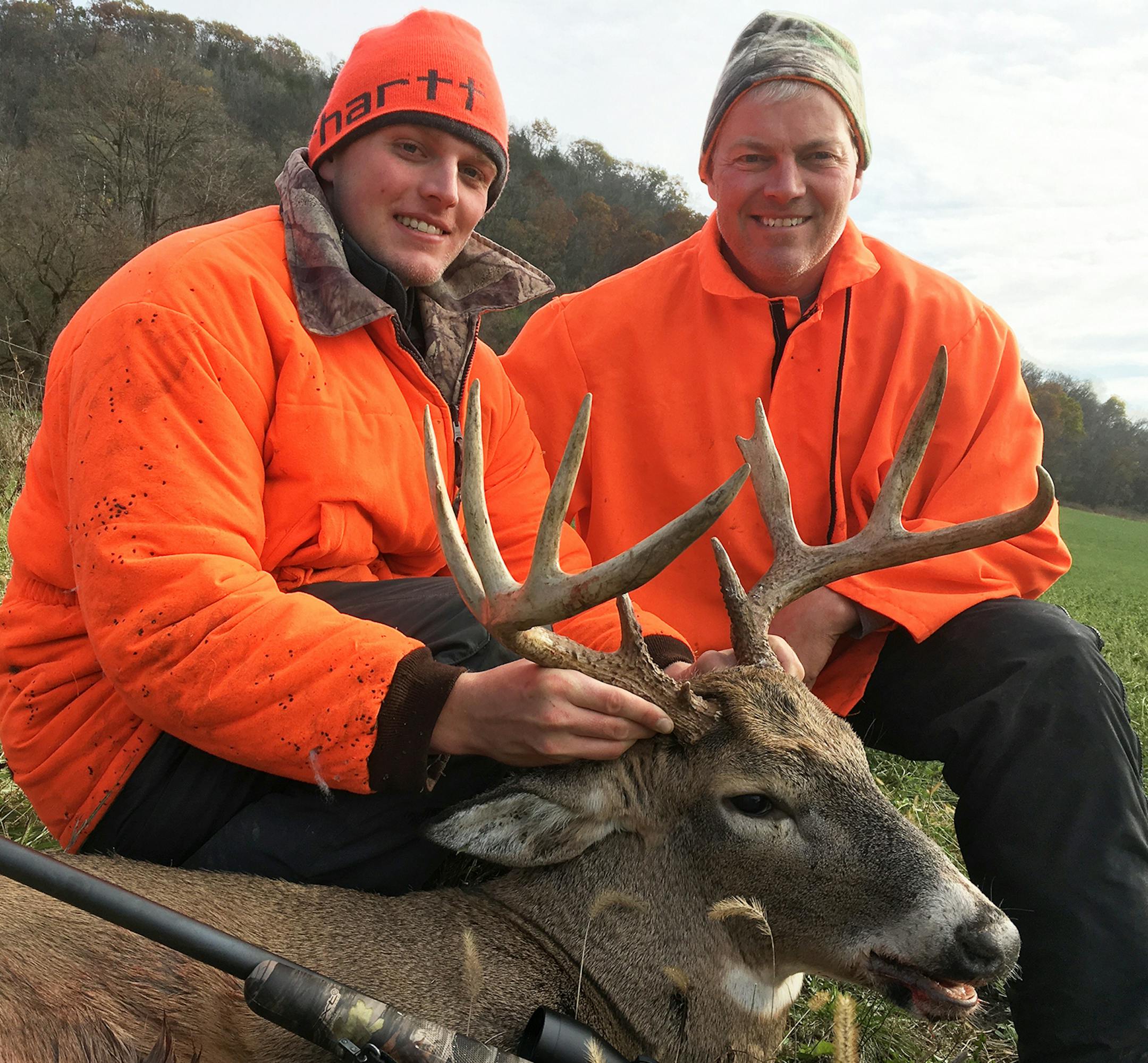 Maple Grove resident Grant Hemze, left, shot this 9-point buck in the bluffs just south of Caledonia. His father, David Hemze, right, found the deer a mile away from where it was shot.