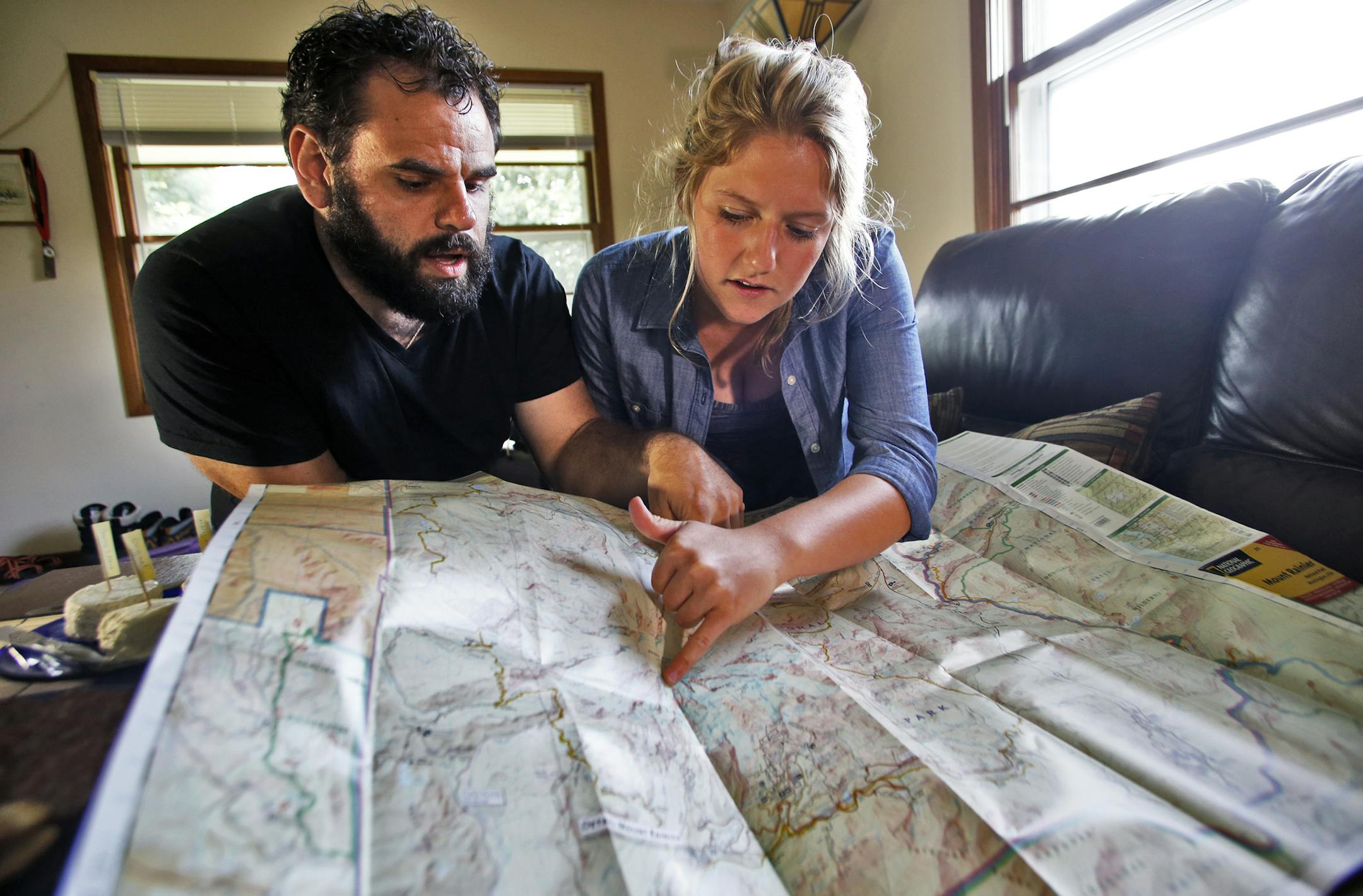 Despite the risk, Jeff Alley, left, and Ashley Melco prepared to climb Mount Rainier, a trip they’d been planning for months, even after hearing that a friend died on the mountain.