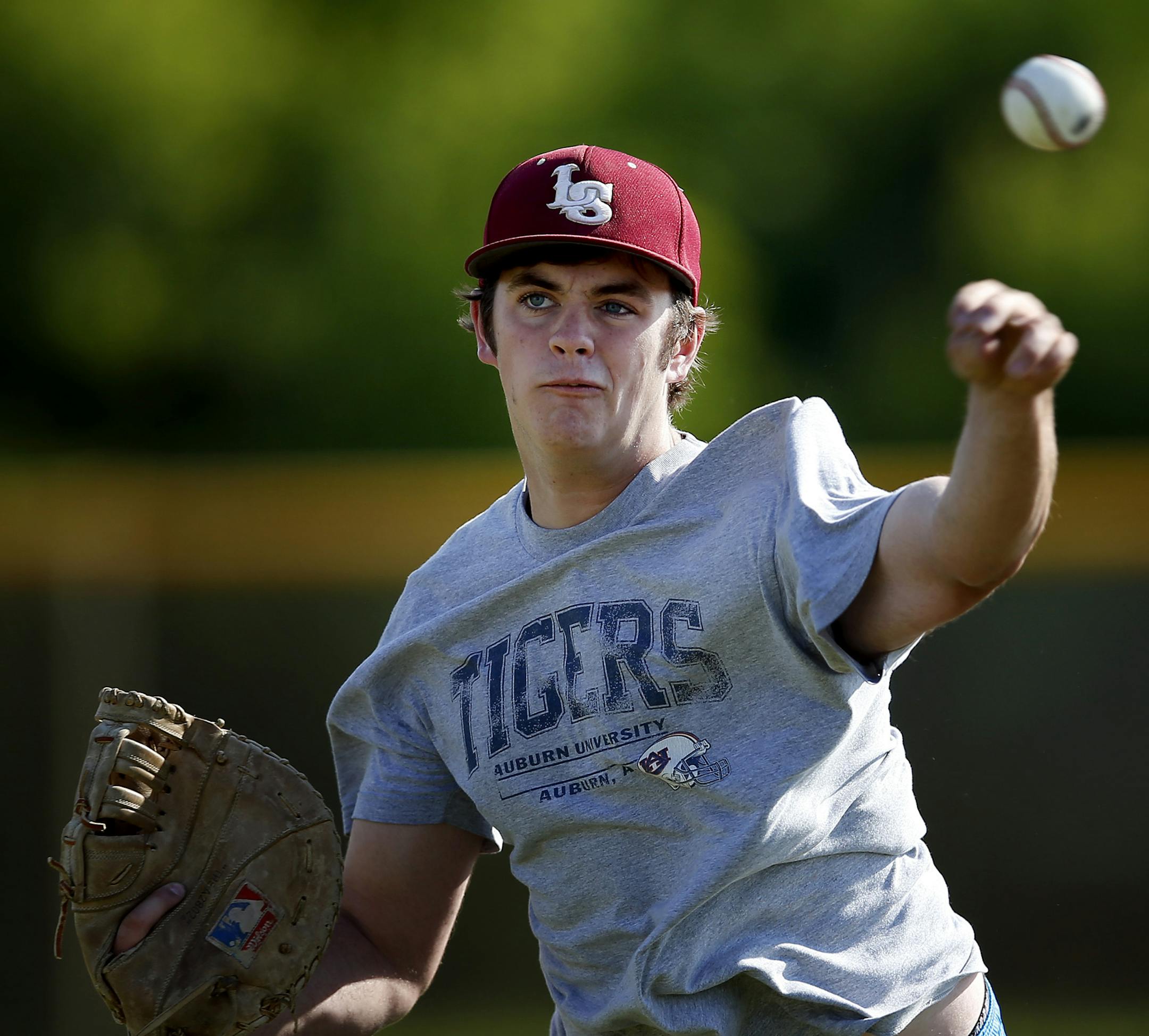 Lakeville South first baseman / pitcher Mitch Maurer during practice on Tuesday. ] CARLOS GONZALEZ cgonzalez@startribune.com - June 10, 2014, Lakeville, Minn., Lakeville South High school prep baseball practice. team working out and doing a drill that shows team unity. They found some late chemistry to win their section playoffs after just winning two games all season.