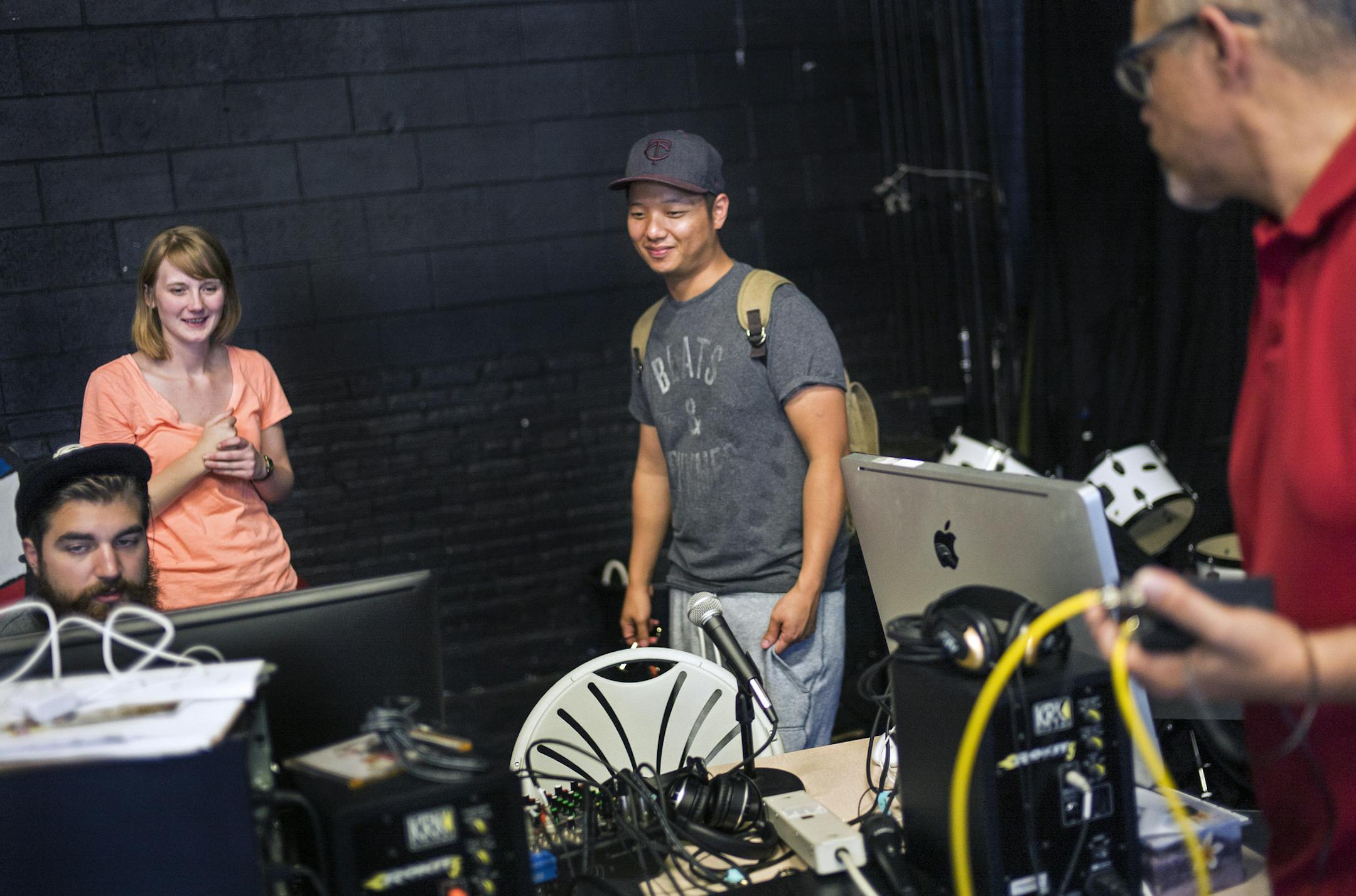 Engineer Jon Riddle helps Vong Lee record his "Power Hour" music show at the Chat Studio. Lee focuses on underplayed hip-hop tracks in his show. Far left, Julie Censullo is a coordinator while Philip Garcia, far right has a smooth jazz/ R&B show called "Midday Escape." A handful of low-power community radio stations are popping up around the Twin Cities, a product of a change to federal communications law in 2011 that opened up more frequencies to groups that hadn't been able to get them.]Richar
