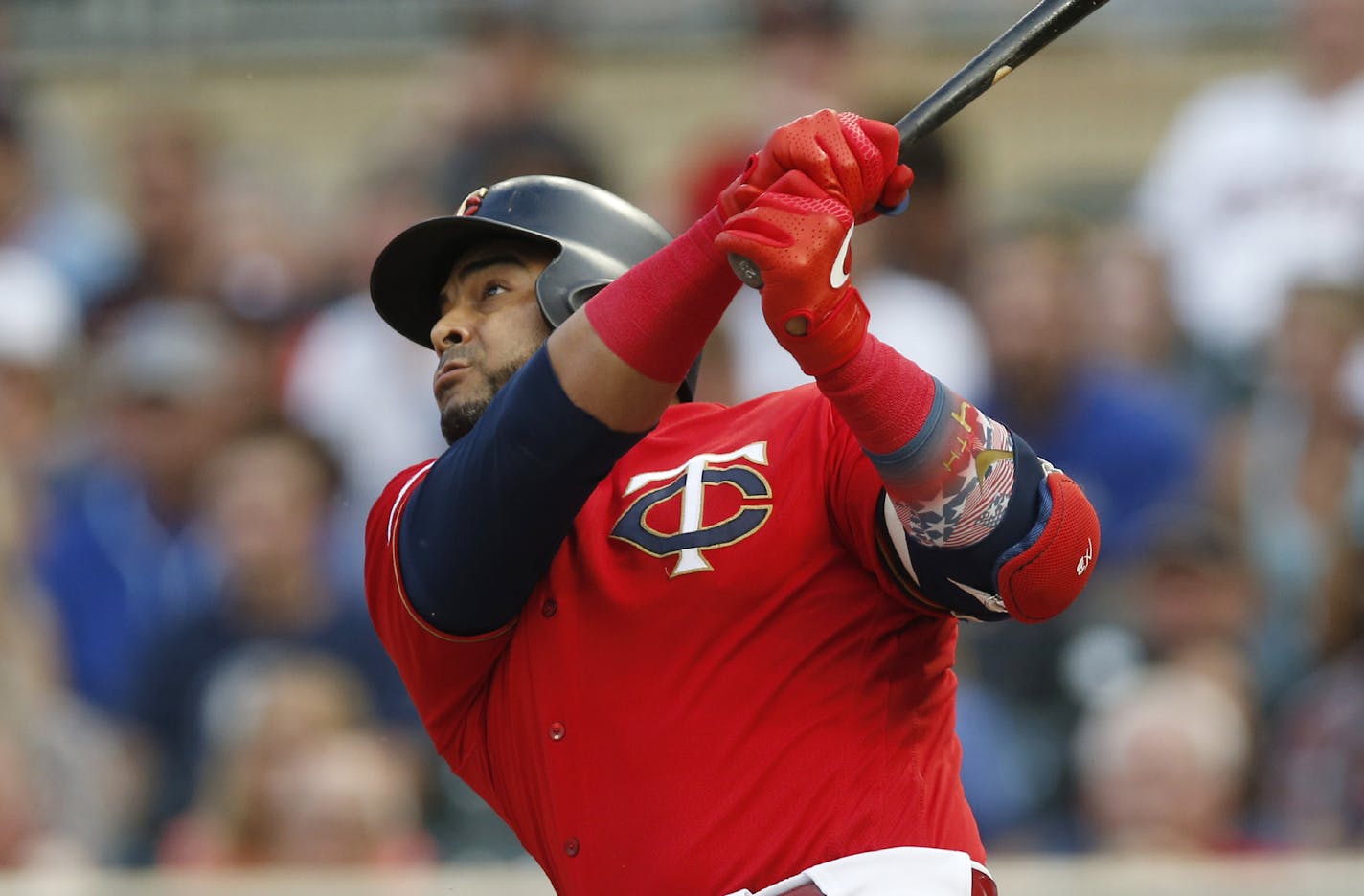 Minnesota Twins' Nelson Cruz bats against the Kansas City Royals in the first inning of a baseball game Friday, Aug. 2, 2019, in Minneapolis. (AP Photo/Jim Mone)