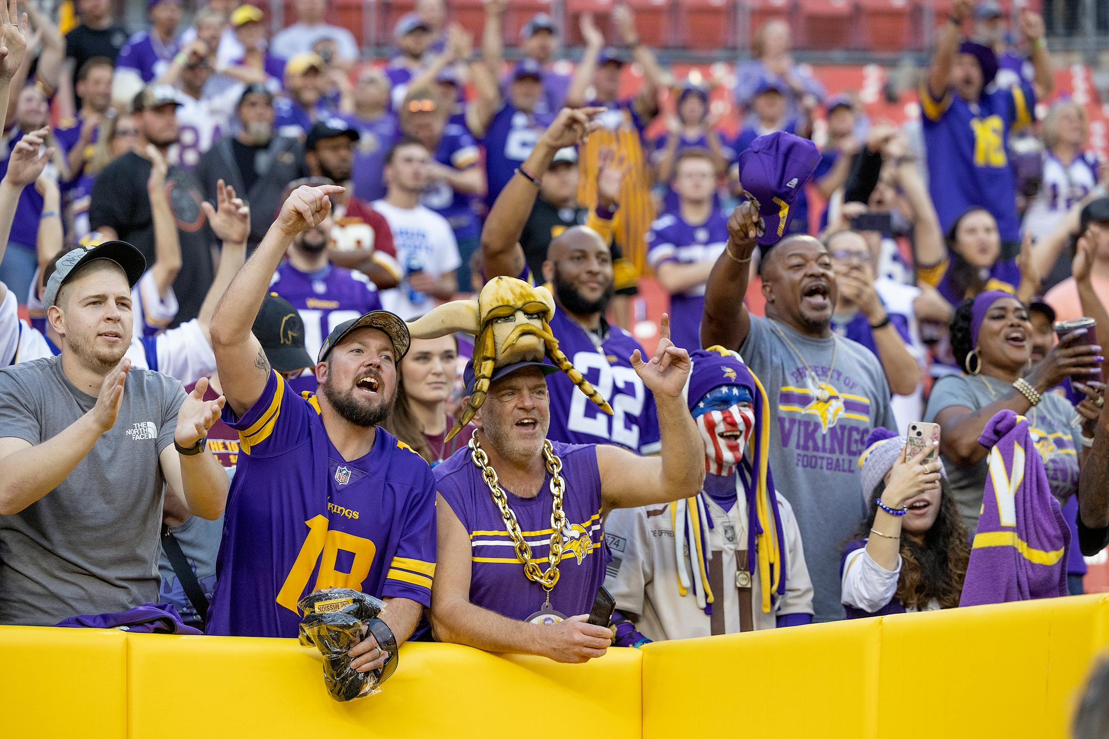 Minnesota Vikings fans celebrate their 20-17 victory over the Washington Commanders.