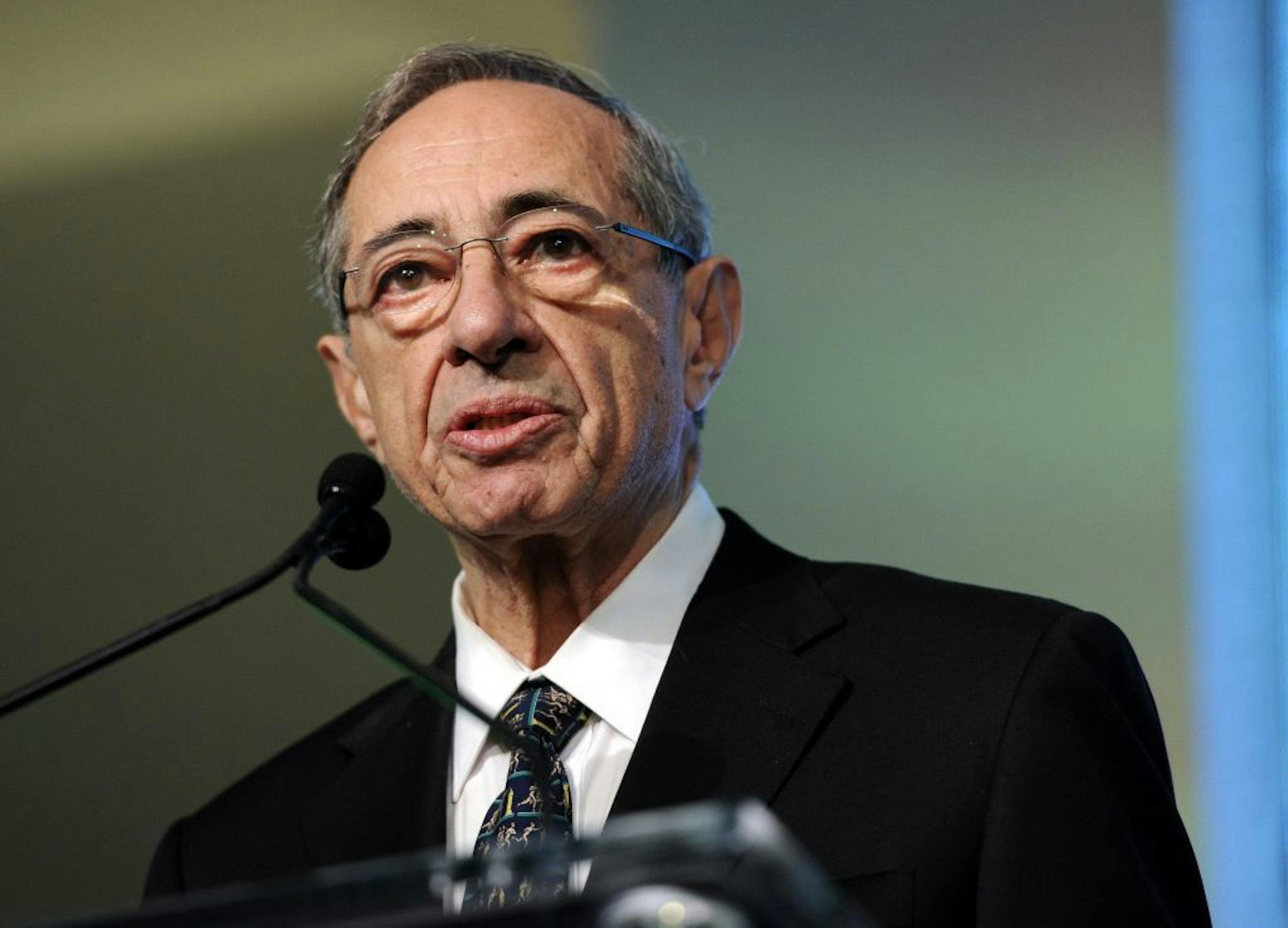 FILE- In this Oct. 18, 2011 file photo, former New York Gov. Mario Cuomo speaks from the podium at the Game Changers Awards at Skylight Soho in New York. Officials say New York Gov. Andrew Cuomo's father, former Gov. Mario Cuomo, has been hospitalized. The governor's office says Saturday, Nov. 29, 2014, the elder Cuomo is being treated for a heart condition. A gubernatorial spokeswoman says the 82-year-old former three-term governor is in good spirts and is thankful for the best wishes and suppo