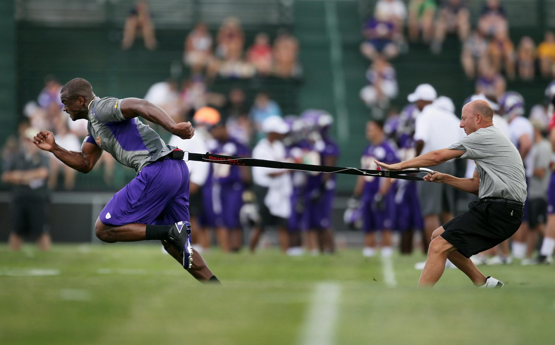 Adrian Peterson was placed on the teams physically unable to perform list today, but continued his rehab as he ran drills with trainer Eric Sugarman during the first day of practice at Minnesota State University, Mankato Friday July 27, 2012 Mankato ,MN .
