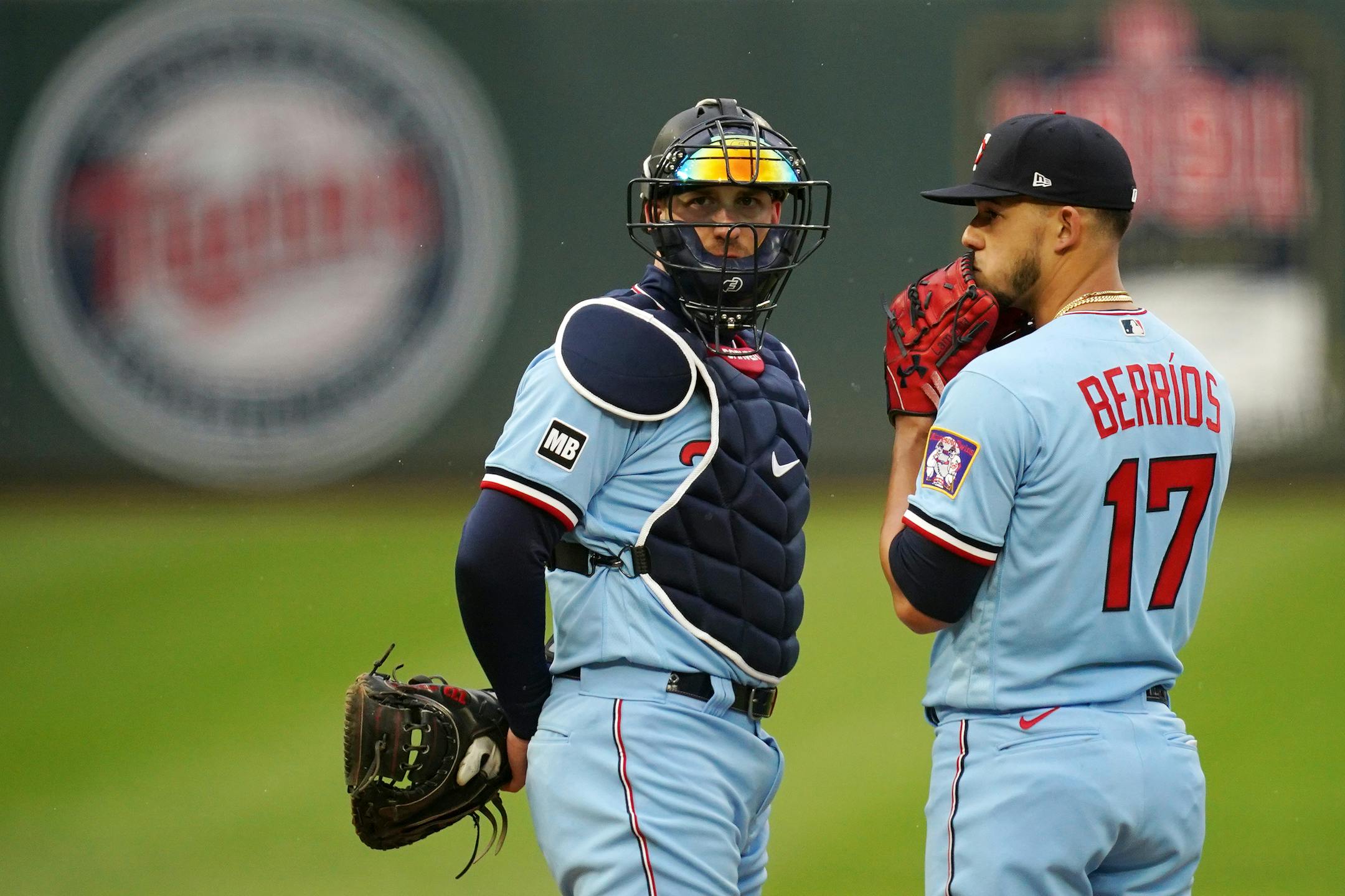 Minnesota Twins catcher Mitch Garver (8) talked with starting pitcher Jose Berrios (17) on the mound in the fifth inning of the second game.