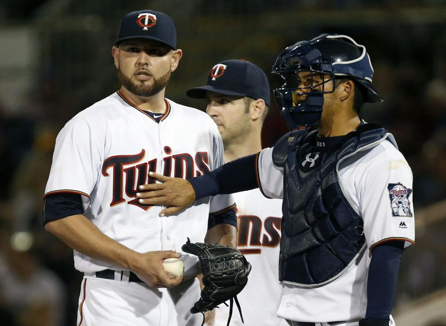 Minnesota Twins catcher Kurt Suzuki patted pitcher Ricky Nolasco as he before he was pulled from the game during spring training in Fort Myers.