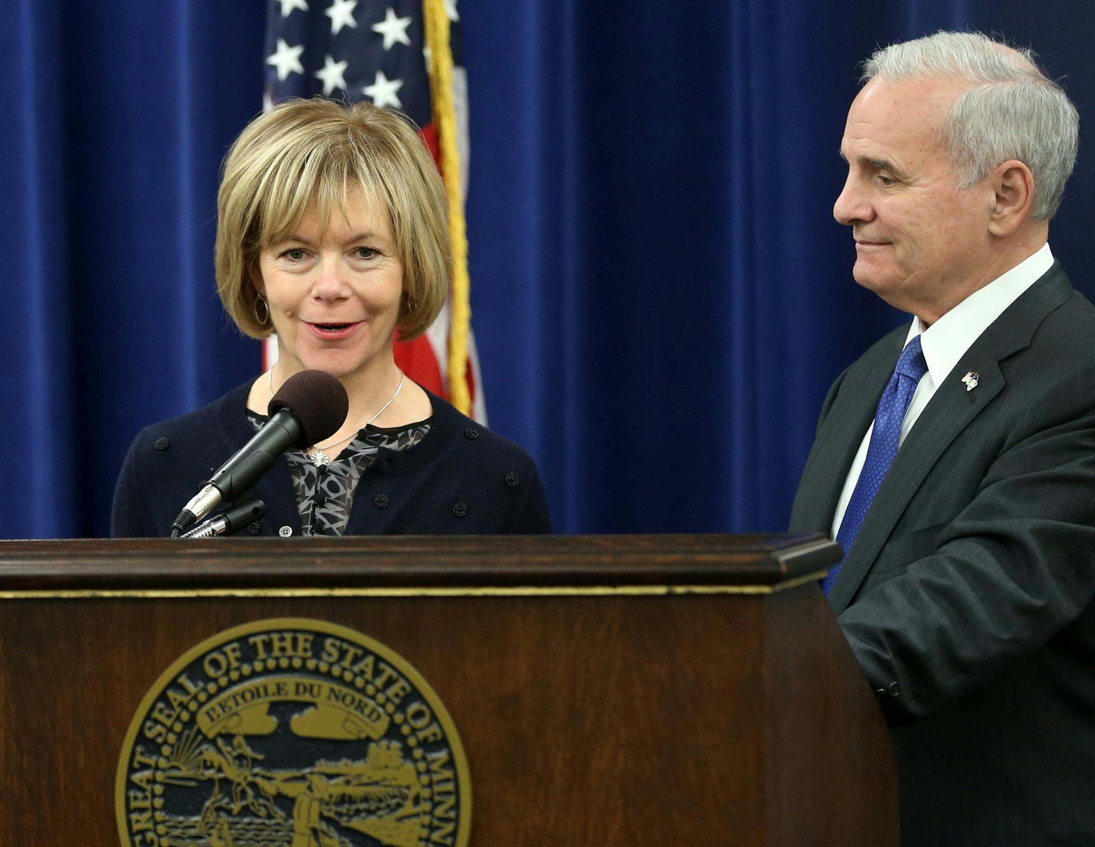 Minnesota Gov. Mark Dayton, right, listens as running mate Tina Smith answers a question during a press conference, Wednesday, Nov. 5, 2014, in St. Paul, Minn. after Dayton won re-election Tuesday in his race against Republican Jeff Johnson. (AP Photo/Jim Mone)