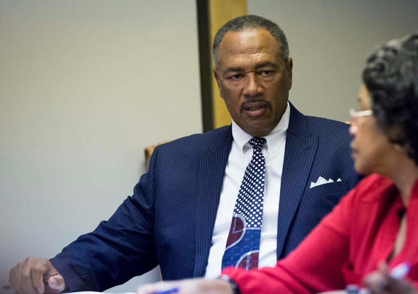 In this 2014 file photo, Community Action of Minneapolis chief executive Bill Davis listened during roll call in a board meeting in Minneapolis.