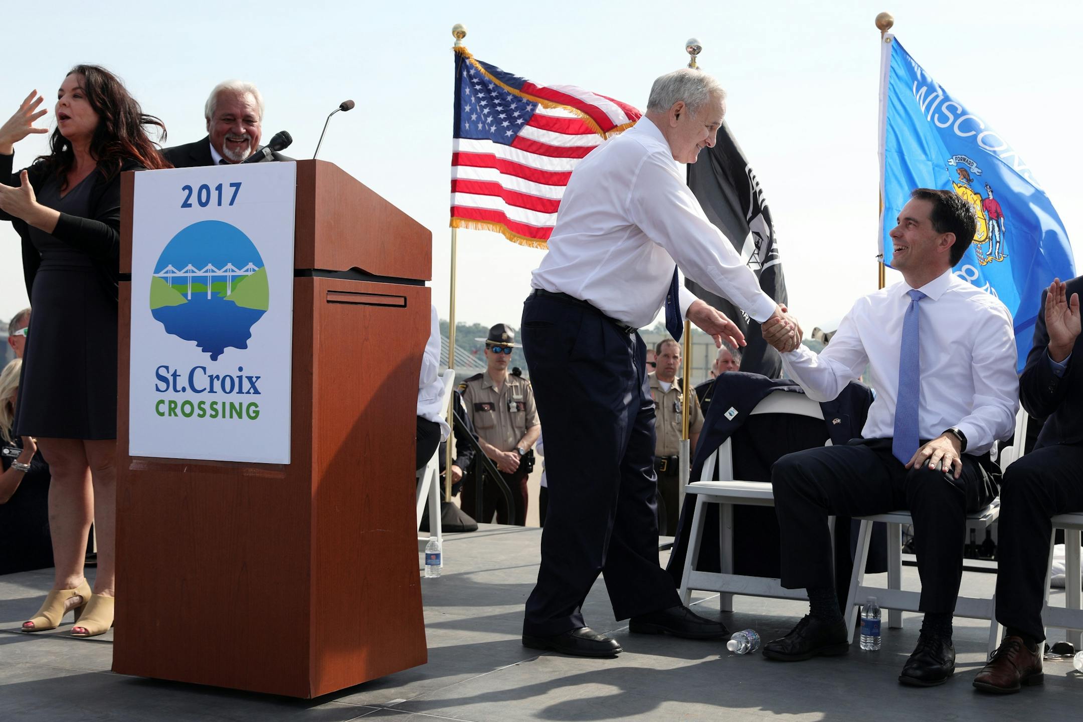 Wisconsin Gov. Scott Walker shook hands with Minnesota Gov. Mark Mark Dayton after Dayton spoke during the ribbon-cutting ceremony.