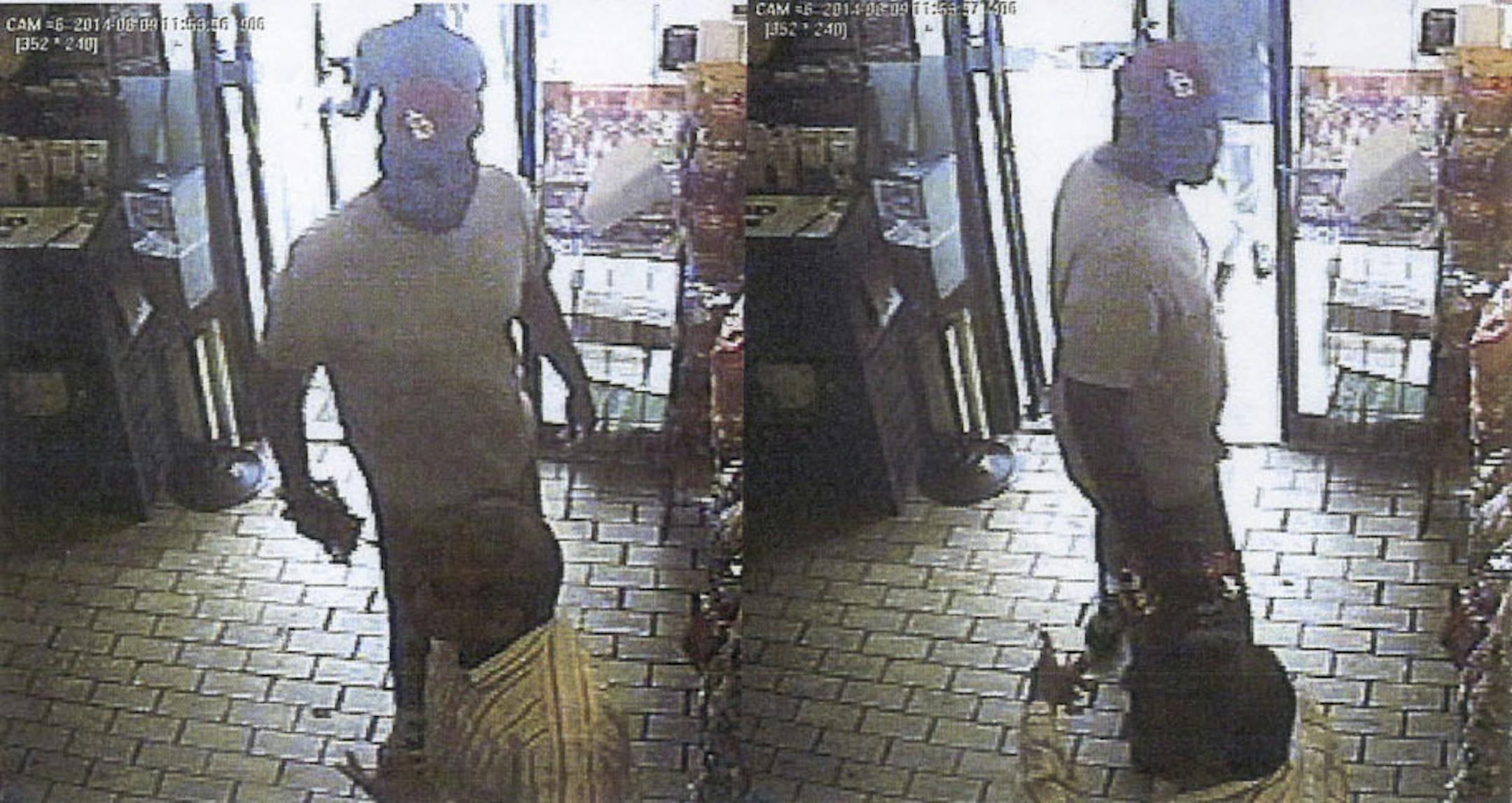 A series of handout frame grabs from security camera video released by the Ferguson, Mo., police shows a convenience store robbery in progress, shortly before Michael Brown was fatally shot.