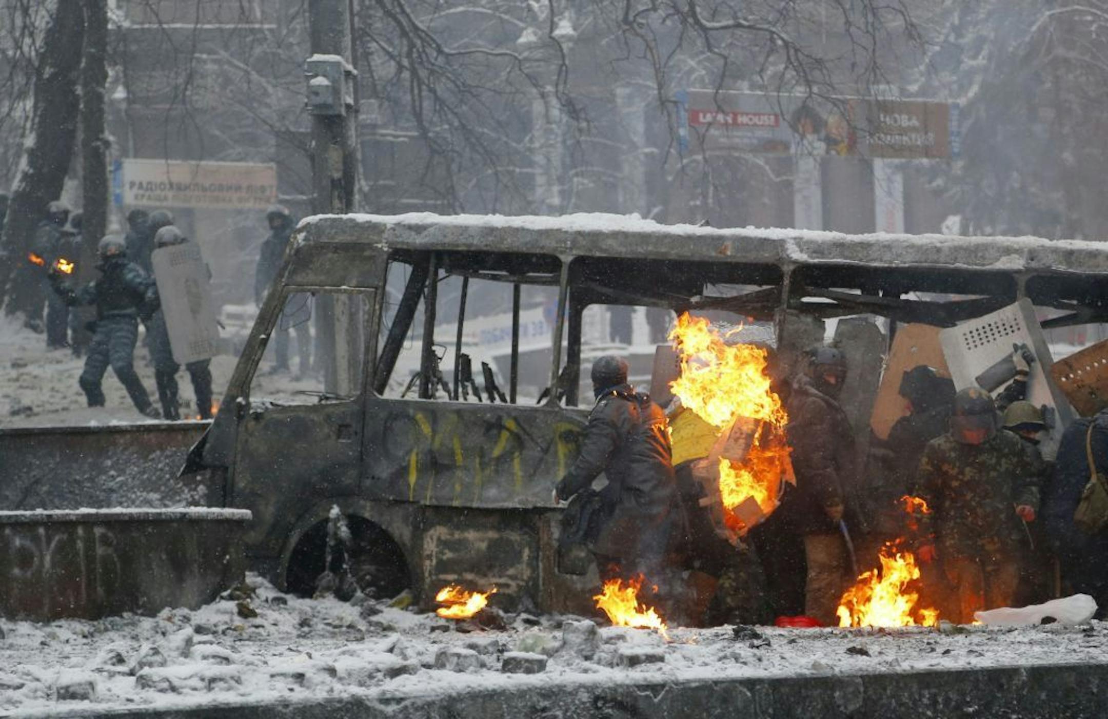 Protesters clash with police in central Kiev, Ukraine, early Wednesday, Jan. 22, 2014.