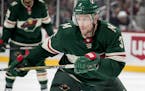 The Minnesota Wild's Charlie Coyle (3) chases the puck in the first period against the New Jersey Devils on Monday, Nov. 20, 2017, at the Xcel Energy 
