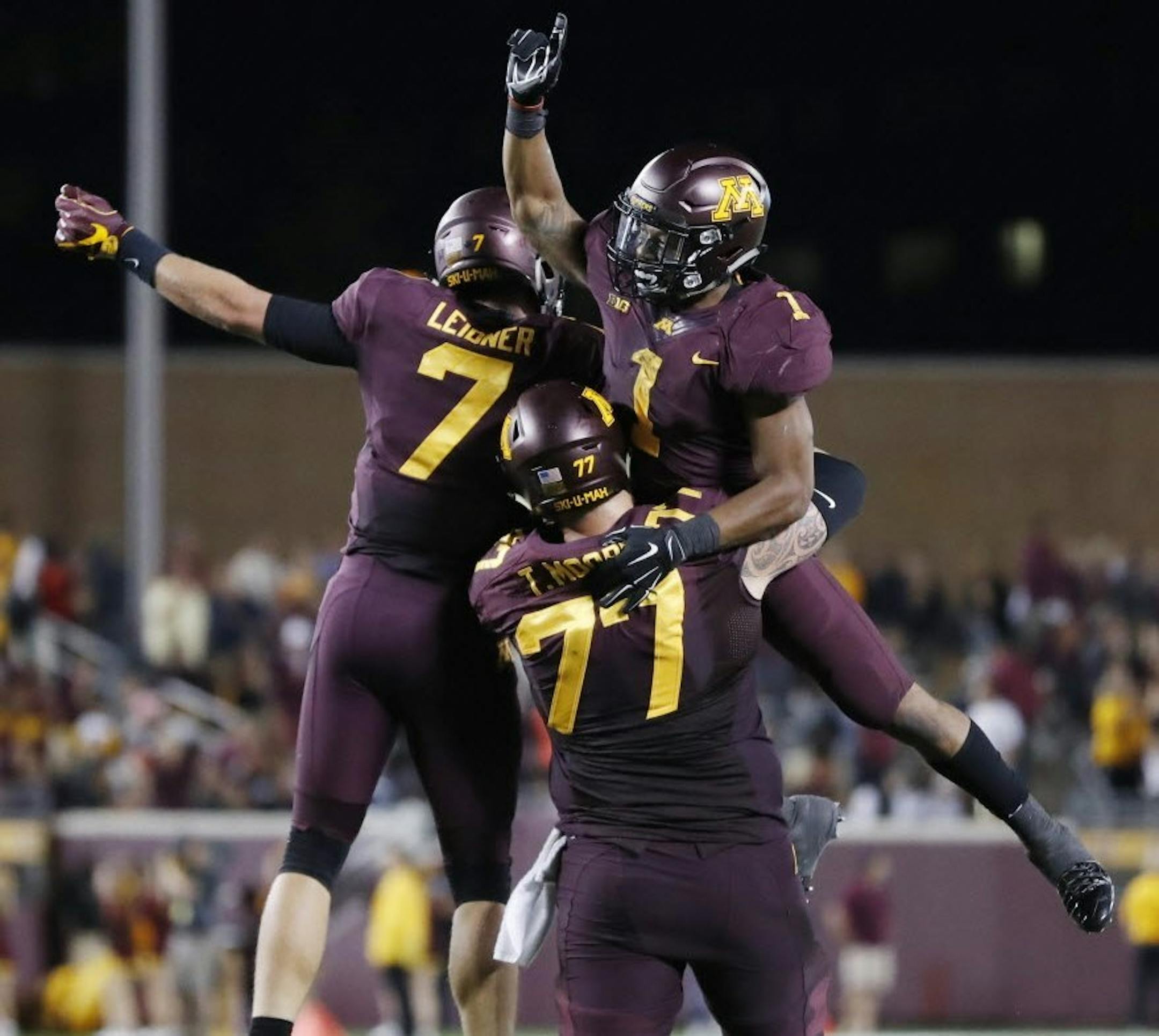 Gophers running back Rodney Smith (1) celebrated his touchdown run with Mitch Leidner, and Tyler Moore in the forth quarter at TCF Bank Stadium Thursday September 1, 2016 in Minneapolis.