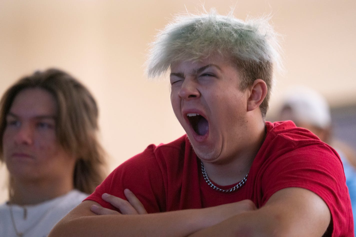 Lakeville South lineman Tegan Drinkerd yawned during a 7AM film session on October 12, 2021. ]