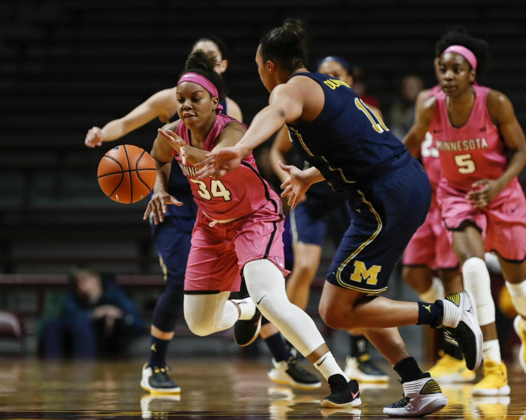 Minnesota Golden Gophers guard Gadiva Hubbard (34) grabbed a lose ball from Michigan Wolverines forward Jillian Dunston (11) in the second half.