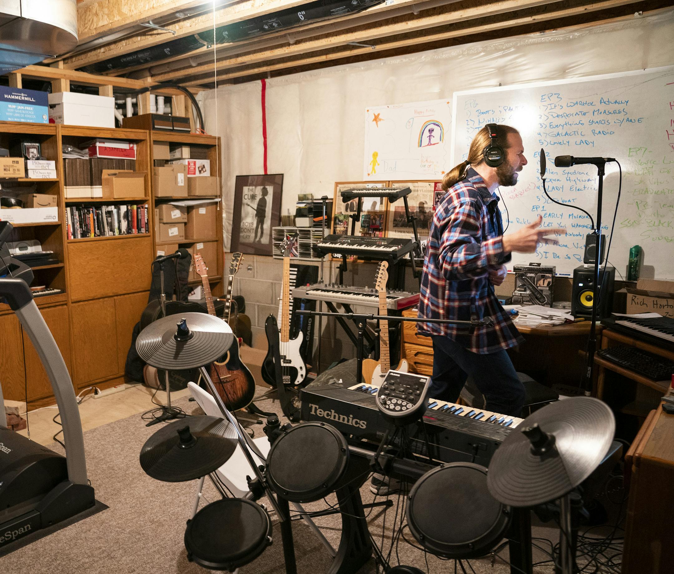 Todd Millenacker works on a demo of a jingle in his basement, which also doubles as his man cave and workout room. ] LEILA NAVIDI &#x2022; leila.navidi@startribune.com BACKGROUND INFORMATION: Todd Millenacker works on a demo of a jingle in his basement in Savage on Thursday, December 6, 2018. Millenacker, a middle-aged dad from Savage who used to have a band but never quite gave up songwriting, has been turning songs he writes into jingles for companies as a side job.