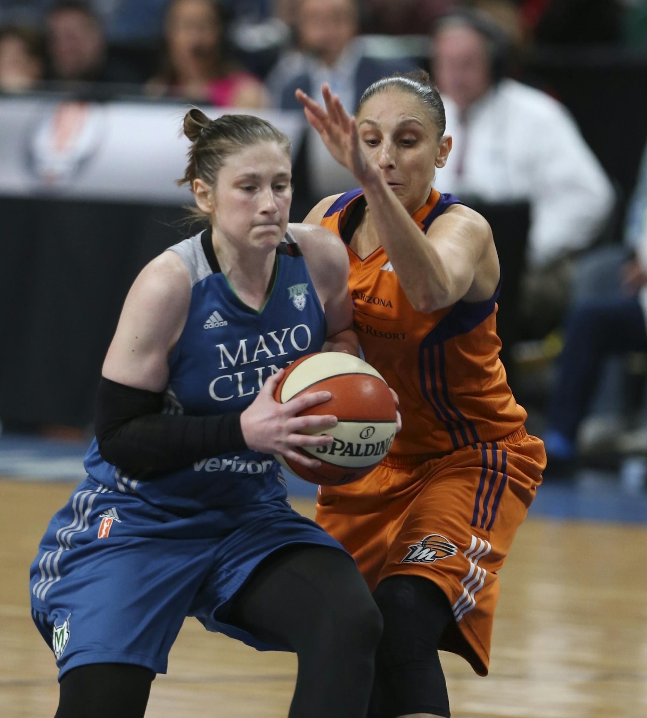 Phoenix Mercury guard Diana Taurasi (3) fouled Minnesota Lynx guard Lindsay Whalen (13) as she drove to the net in the fourth quarter.