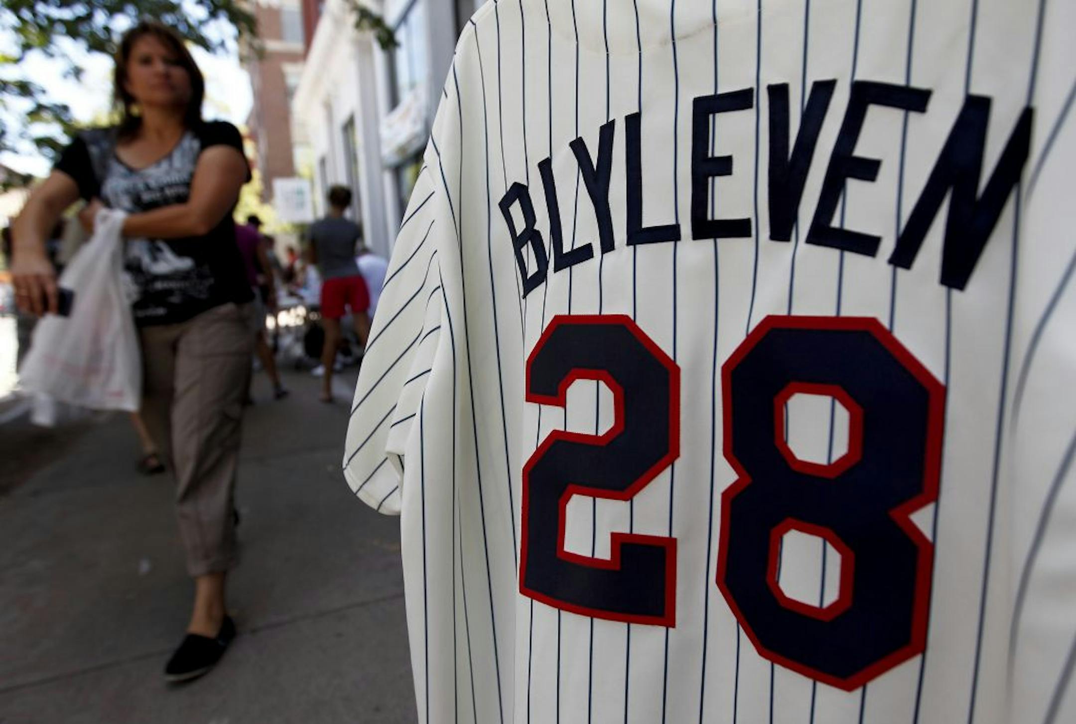 A rack of Bert Blyleven Twins jerseys stood out in a sidewalk display of a memorabilia shop in Cooperstown, N.Y., on Friday. Blyleven will be inducted into the Hall of Fame on Sunday.