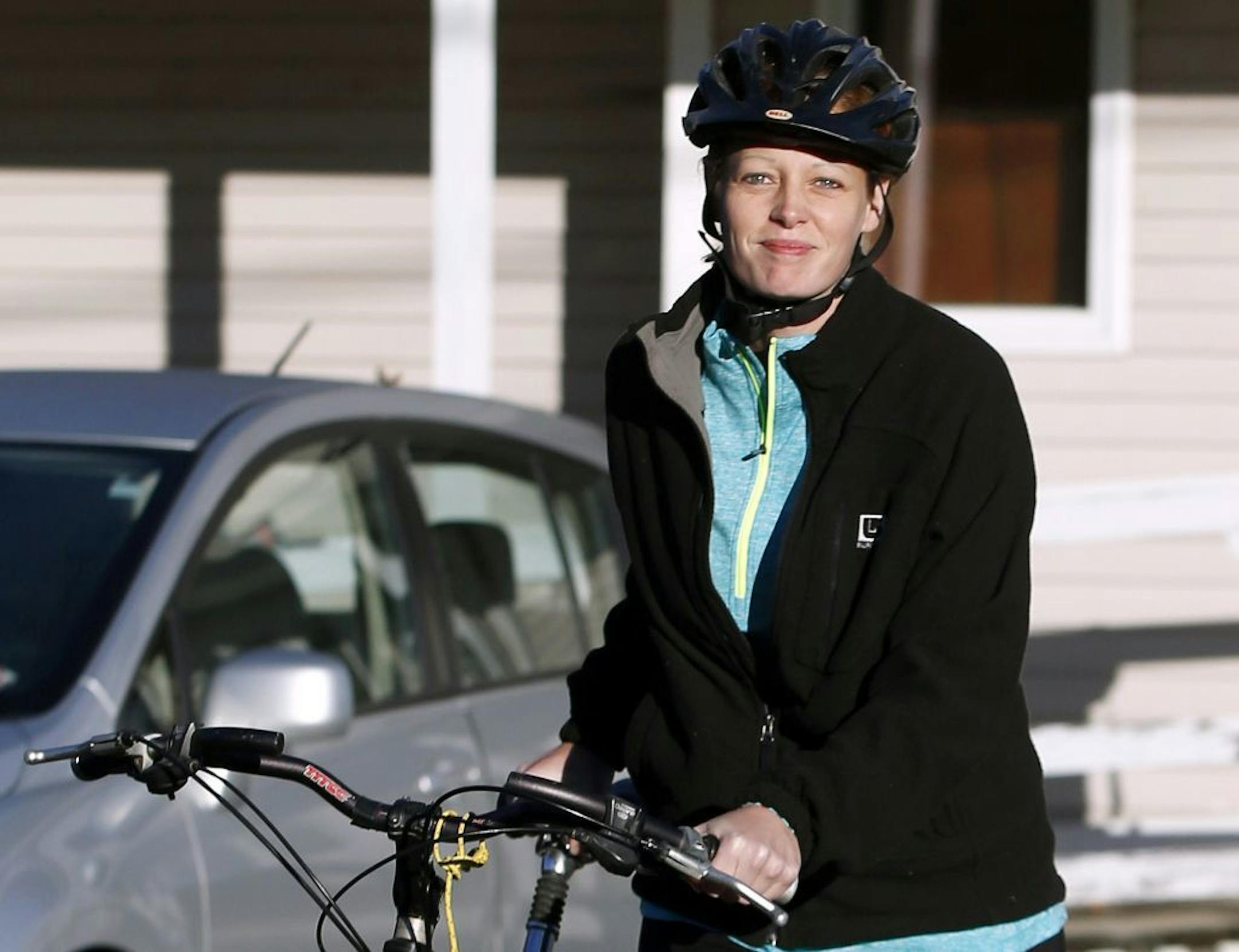 Nurse Kaci Hickox leaves her home on a rural road in Fort Kent, Maine, to take a bike ride with her boyfriend Ted Wilbur, Thursday, Oct. 30, 2014. The couple went on an hour-long ride followed by a Maine State Trooper. State officials are going to court to keep Hickox in quarantine for the remainder of the 21-day incubation period for Ebola that ends on Nov. 10. Police are monitoring her, but can't detain her without a court order signed by a judge.