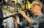 U.S. film director and actor Woody Allen plays clarinet during a concert of his Band in Prague, Saturday, Dec. 20, 2008. (AP Photo/CTK, Stanislav Zbyn