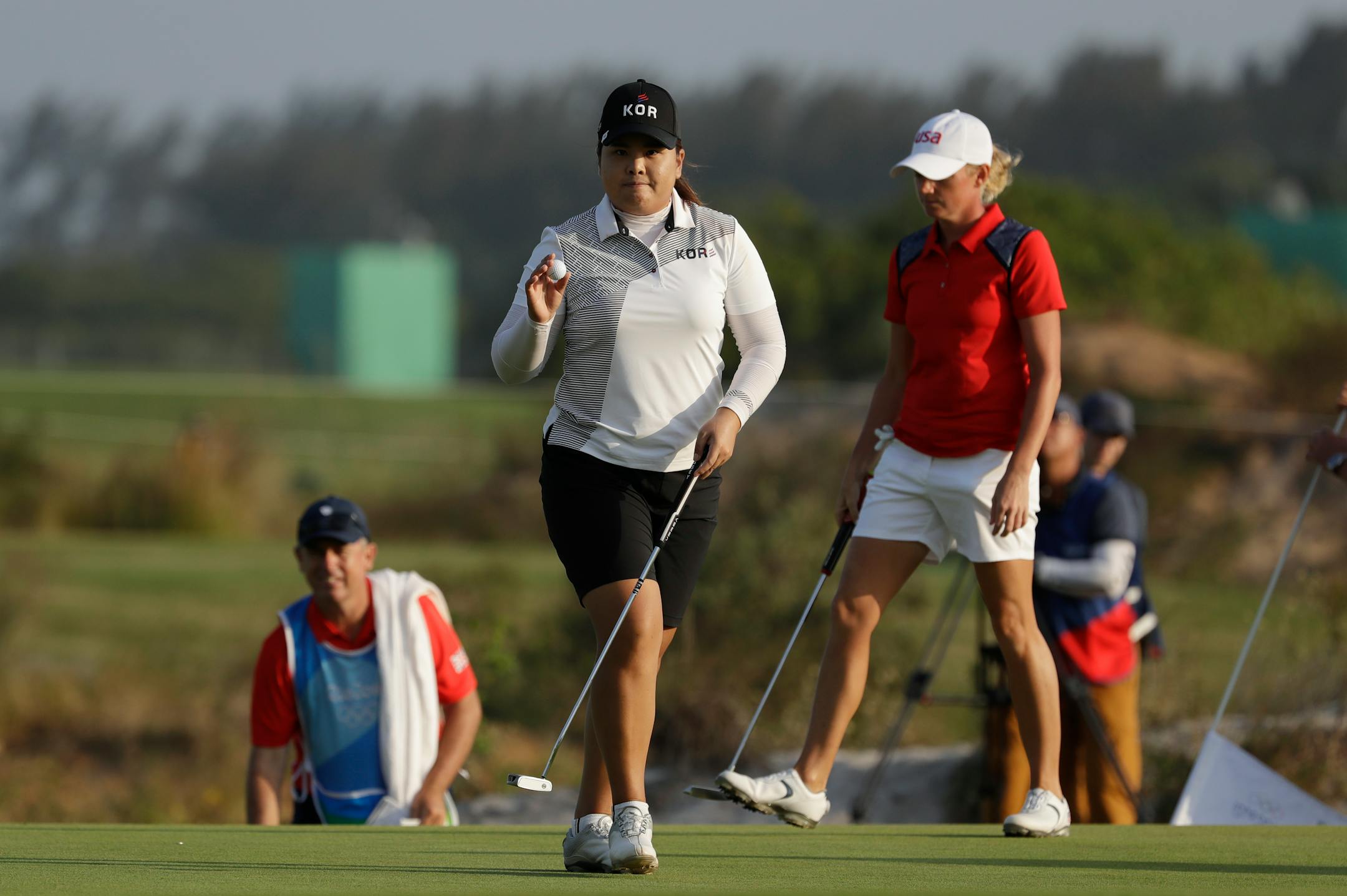 Inbee Park of South Korea walks off the 18th hole after finishing the third round of the women's golf event at the 2016 Summer Olympics in Rio de Janeiro, Brazil, Friday, Aug. 19, 2016. (AP Photo/Alastair Grant)