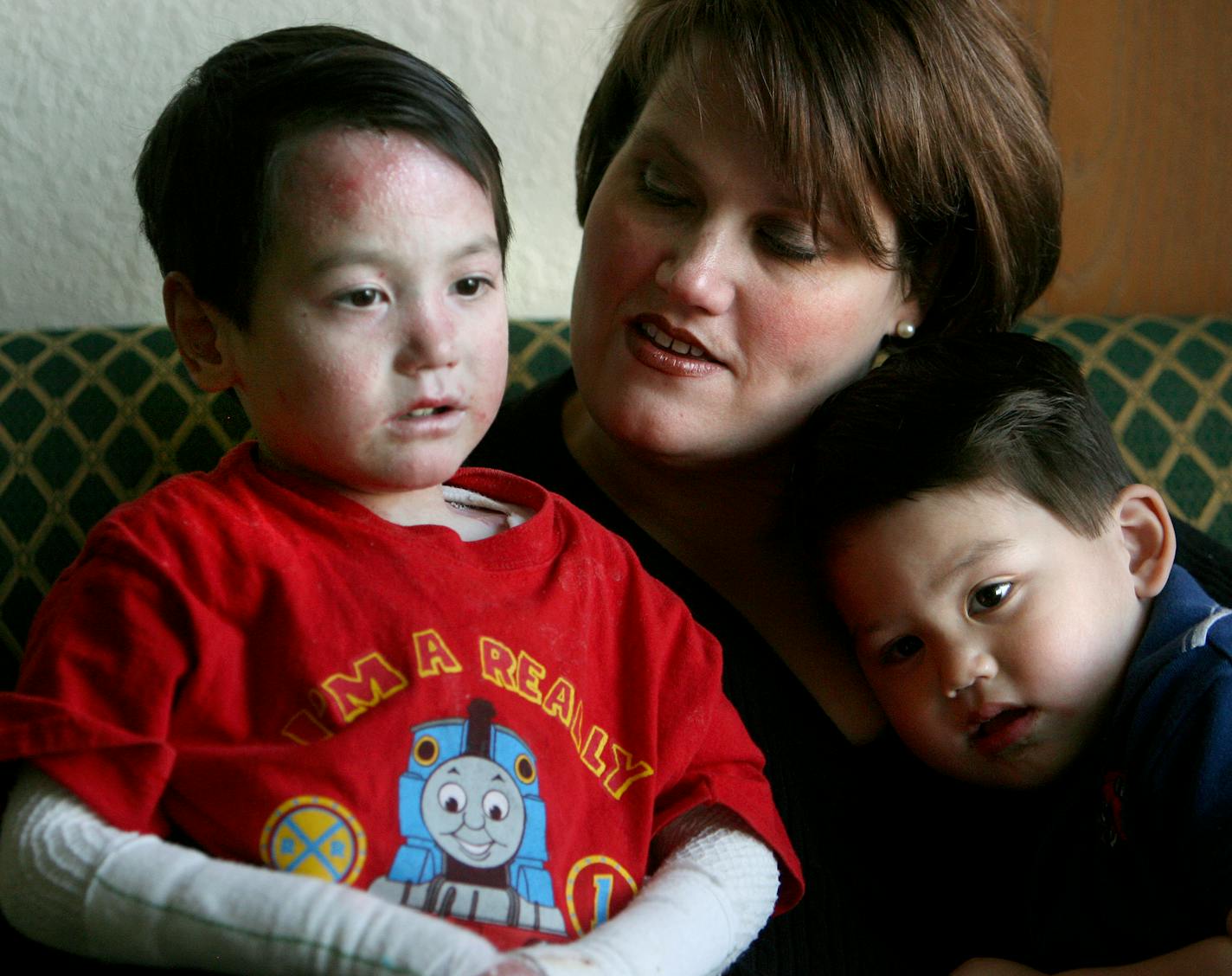 Theresa Liao with two of her sons, Jake, left, and Julian. Younger brother Nate, 2, is apparently cured of the disease after treatment this winter. Jake, with the same disorder, had the treatment Friday.