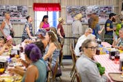 People line up for breakfast inside Hamline Church Dining Hall Thursday, Aug. 24, 2023, at The State Fairgrounds in Falcon Heights, Minn. ]