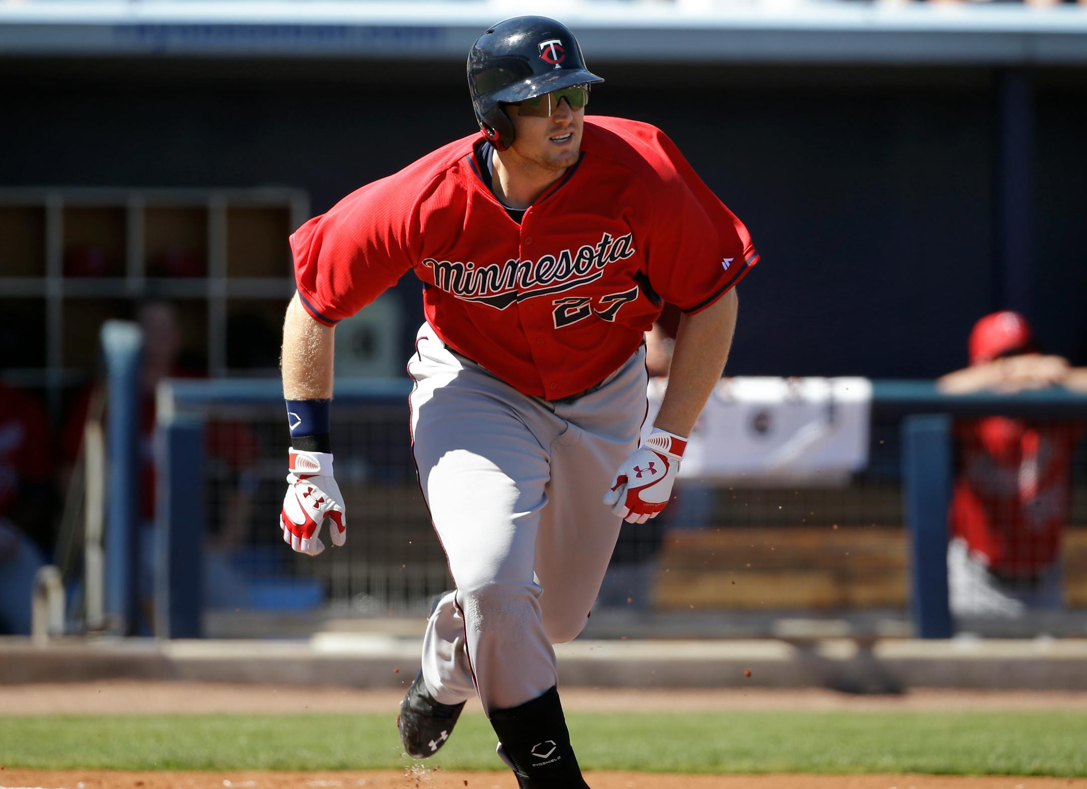 Minnesota Twins' Chris Parmelee runs as he singles in the second inning of an exhibition baseball game against the Tampa Bay Rays, Sunday, March 2, 2014, in Port Charlotte, Fla. (AP Photo/Steven Senne)