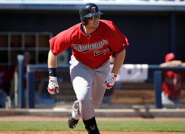 Minnesota Twins' Chris Parmelee runs as he singles in the second inning of an exhibition baseball game against the Tampa Bay Rays, Sunday, March 2, 20