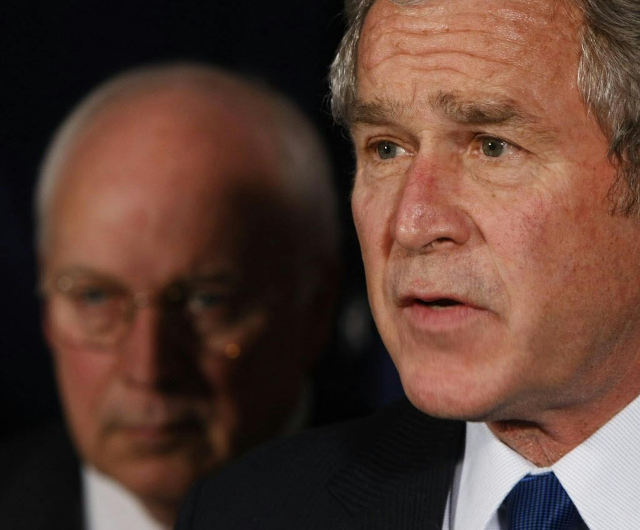 President Bush, right, accompanied by Vice President Dick Cheney, makes remarks on defense spending after a meeting with military leaders at the Pentagon, Thursday, Nov. 29, 2007.