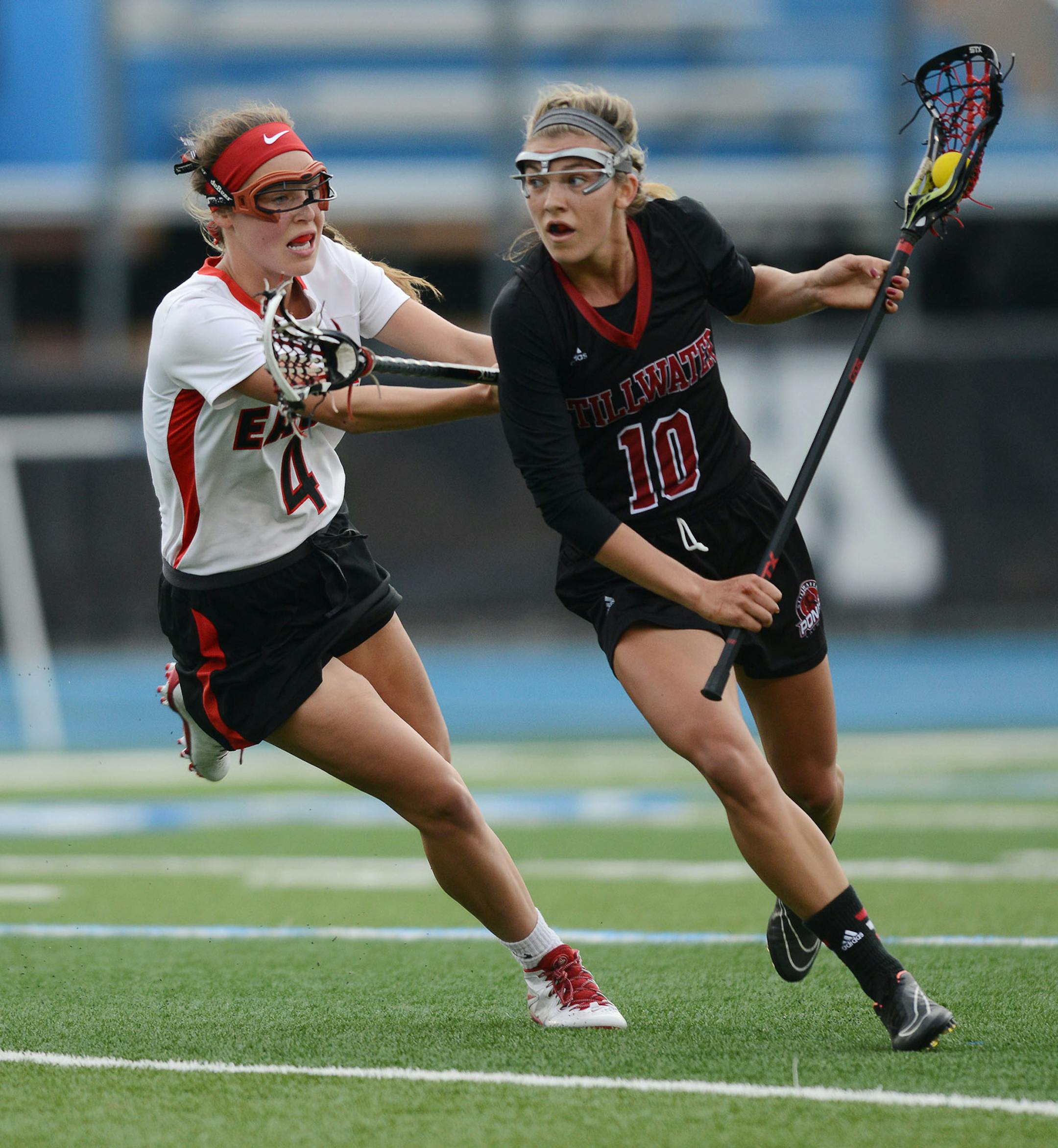 Eden Prairie's Jenny Bren screams at Stillwater Area's Kacie Riggs in the 1st half Thursday evening in Minnetonka. ] RACHEL WOOLF ï rachel.woolf@startribune.com Eden Prairie met Stillwater Area in a girls state lacrosse tournament semifinal game at Minnetonka High School in Minnetonka Thursday evening, June 11, 2015.